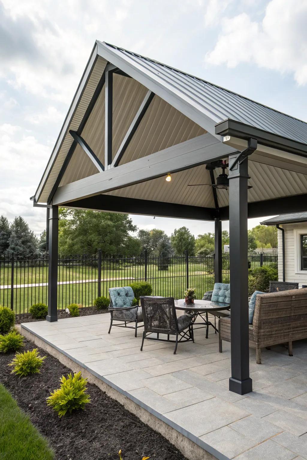 A gable metal roof adds architectural charm to this patio, enhancing its classic appeal.