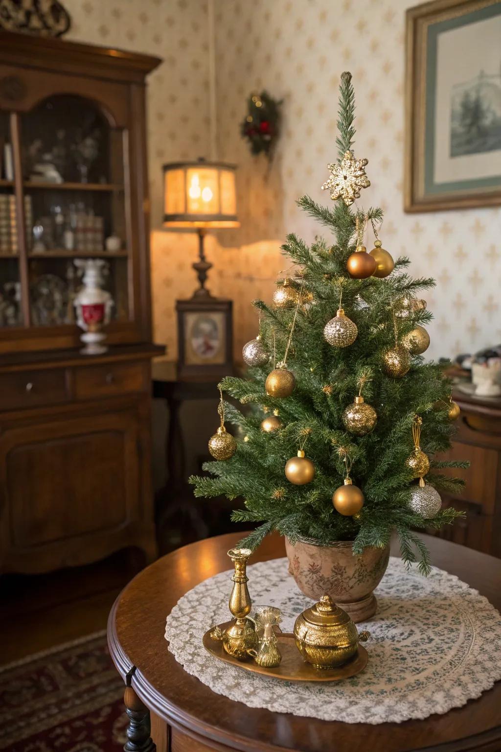 A mini Christmas tree adorned with mercury glass ornaments for vintage elegance.