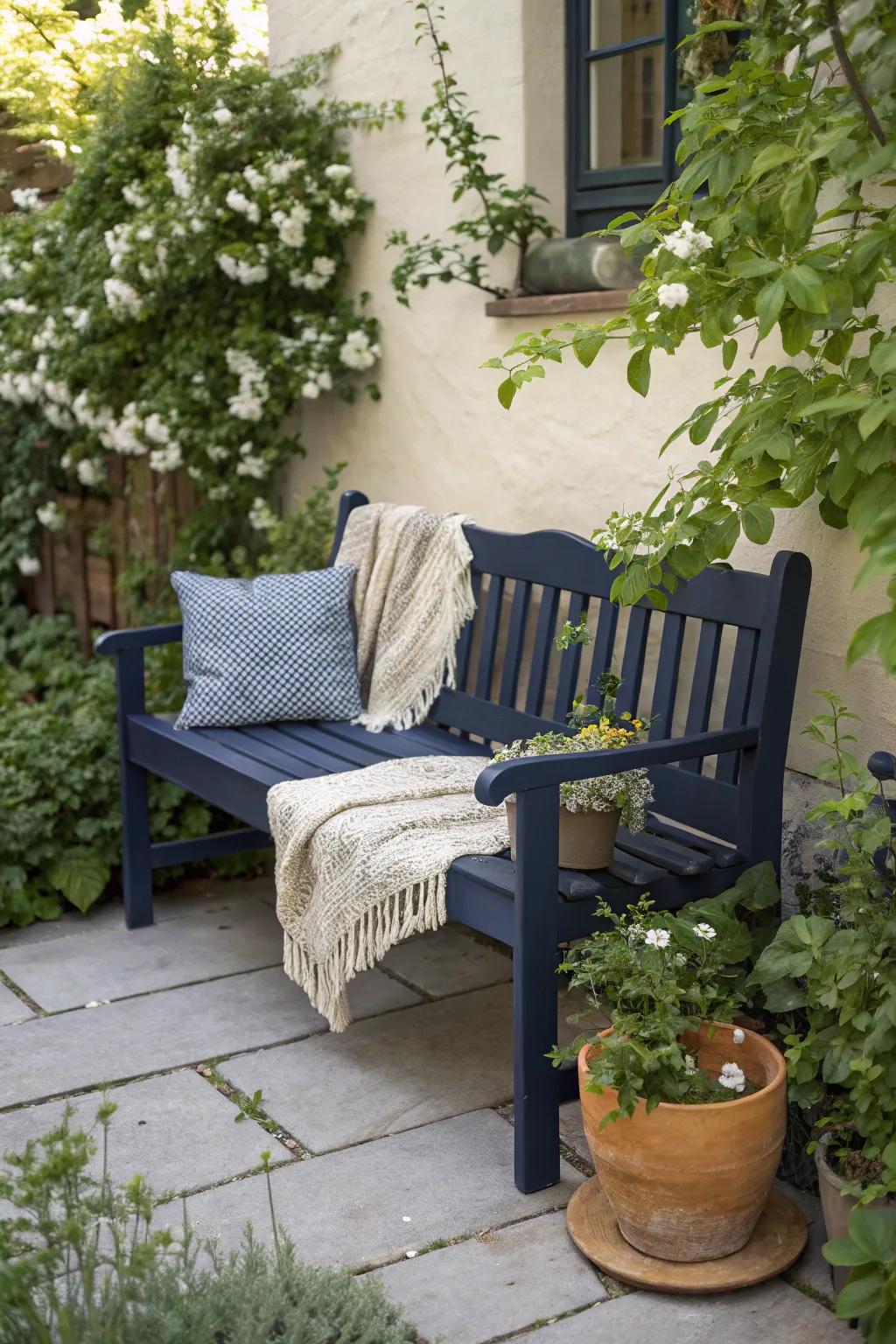 Find serenity with a navy blue bench that brings a touch of the ocean to your garden oasis.