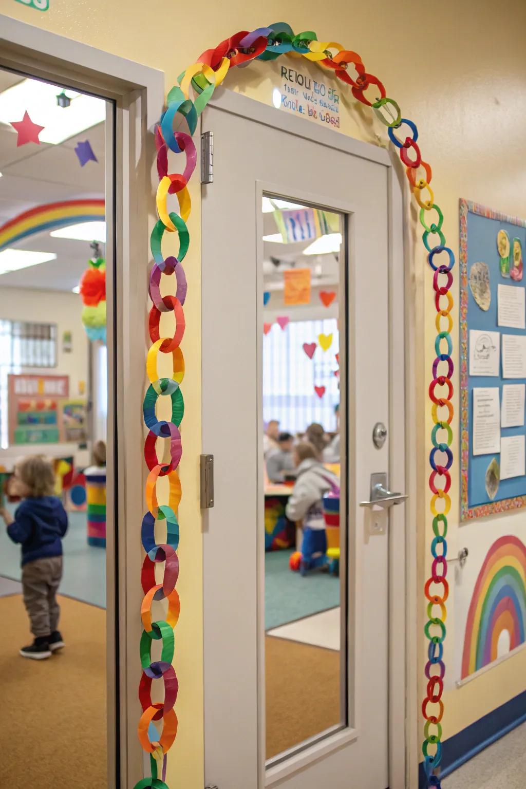 A preschool door brightened with rainbow paper chains.