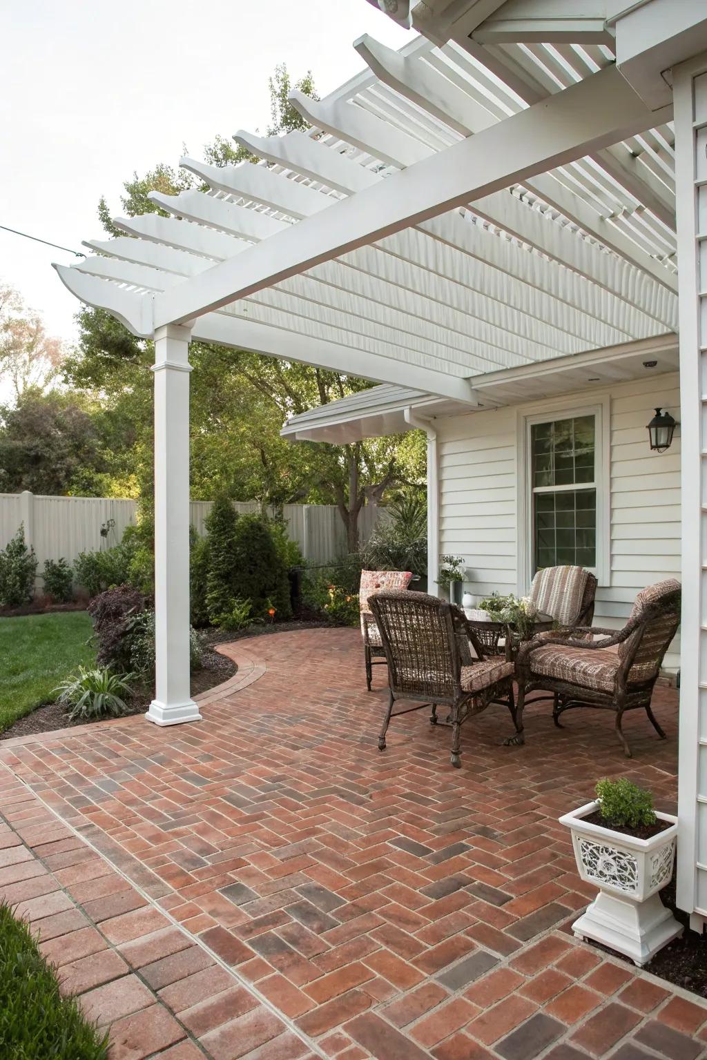 A pergola adds coziness and definition to a brick patio.