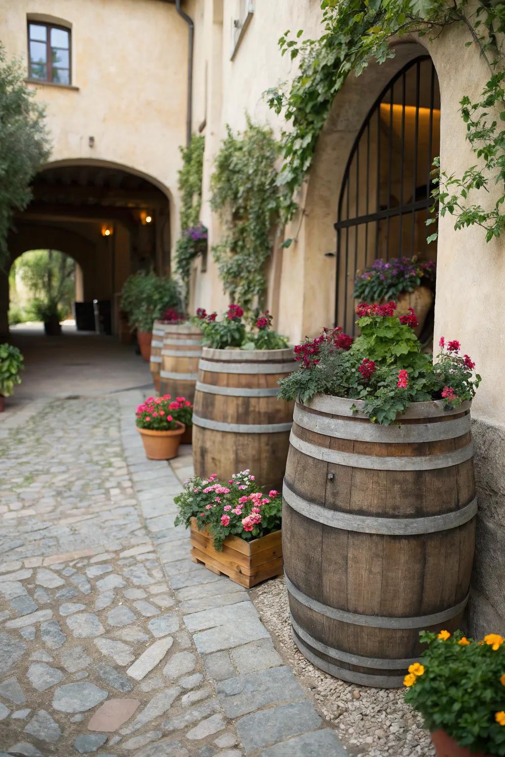 A small courtyard with wooden barrels used as planters.