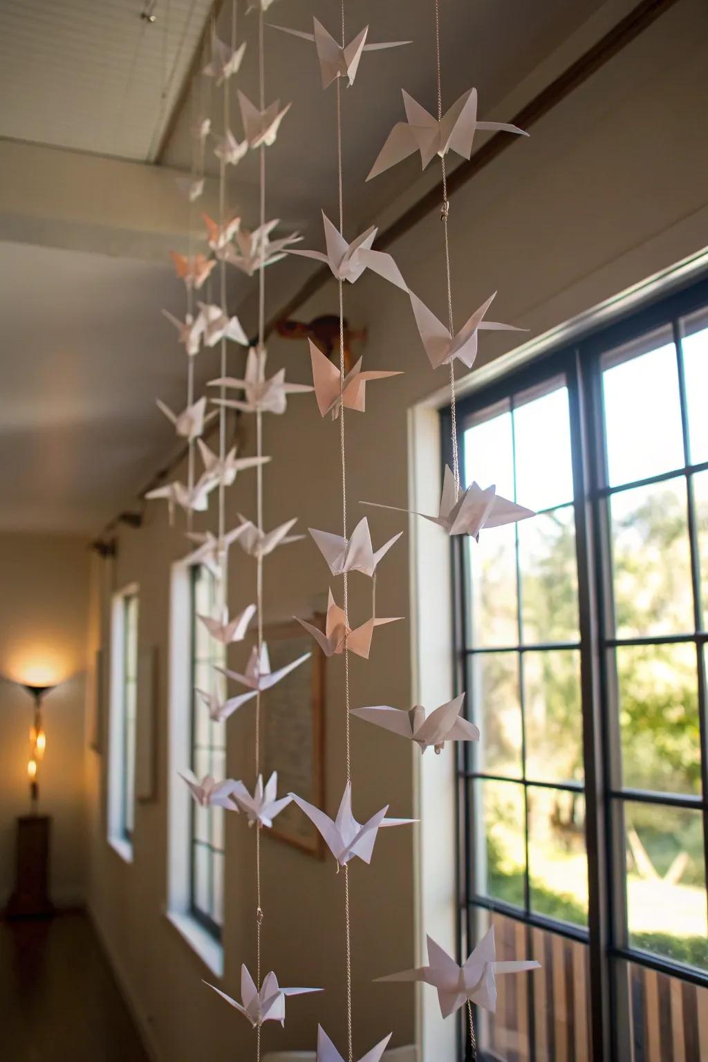 A serene mobile featuring origami cranes, perfect for tranquil spaces.