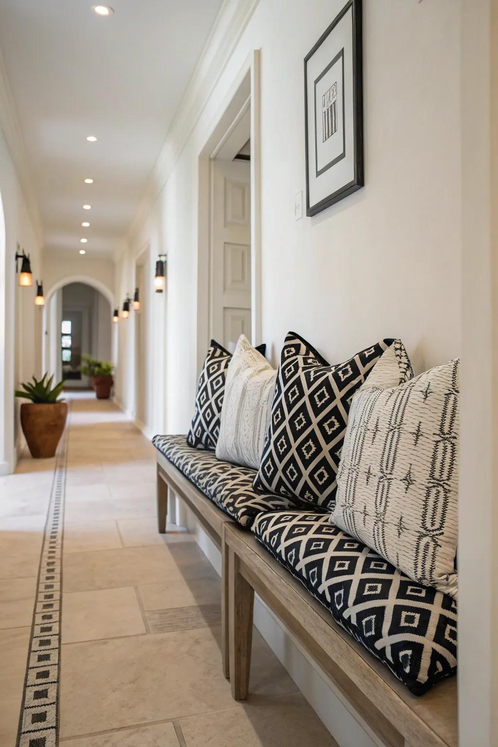 Black and white pillows add a personal touch to this hallway.