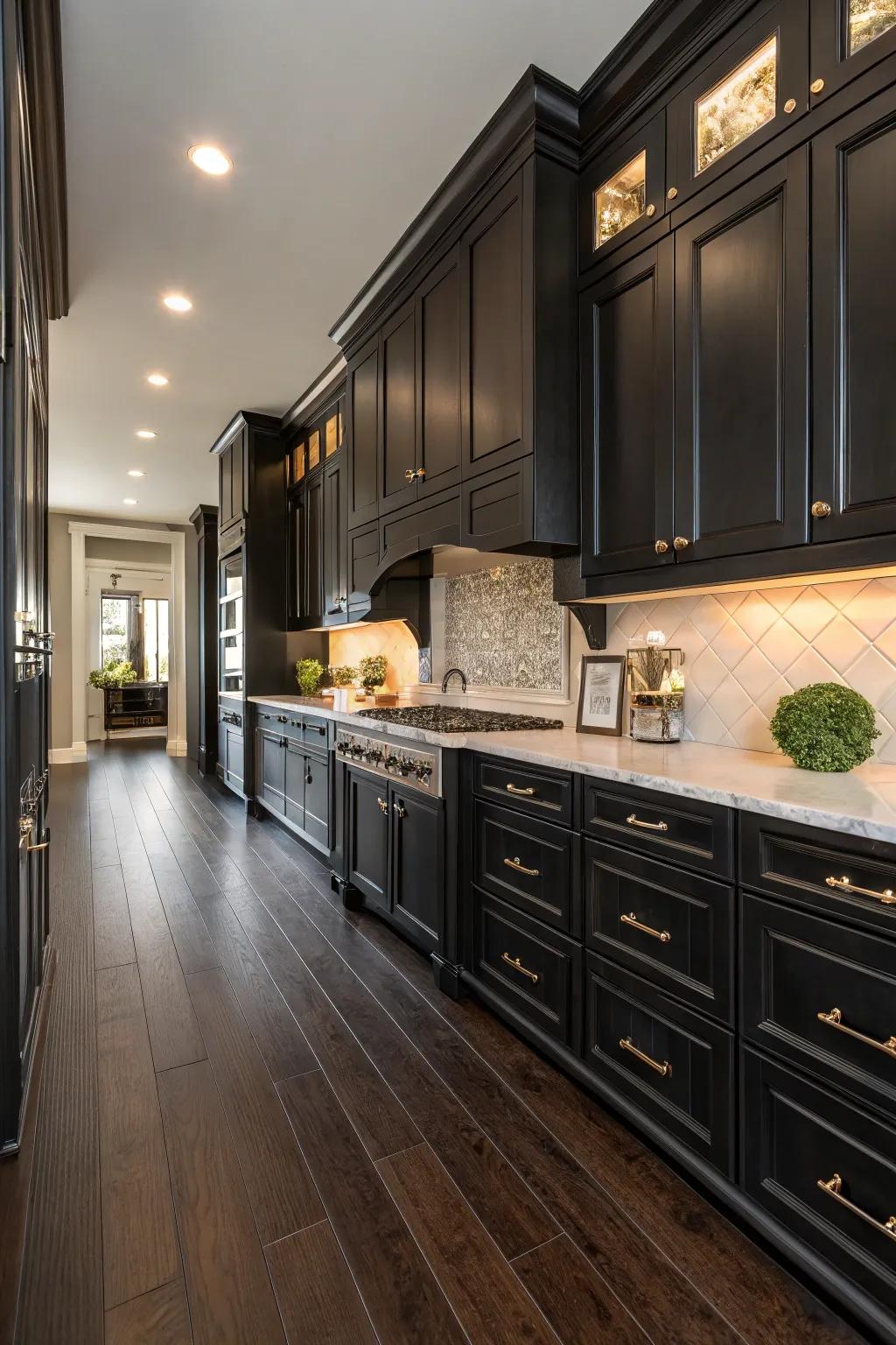 Dark hardwood floors adding drama to a kitchen with black cabinetry.