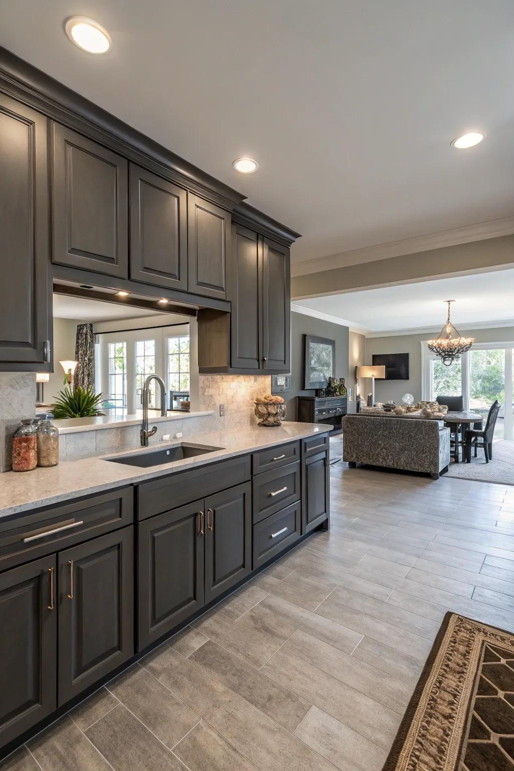 Open floor plans with dark gray cabinets encourage flow and connectivity.