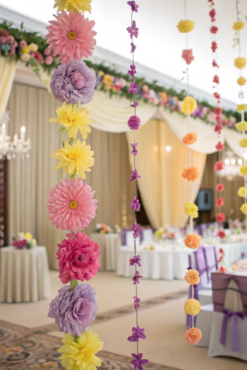 Playful paper flower garlands for a whimsical wedding atmosphere.