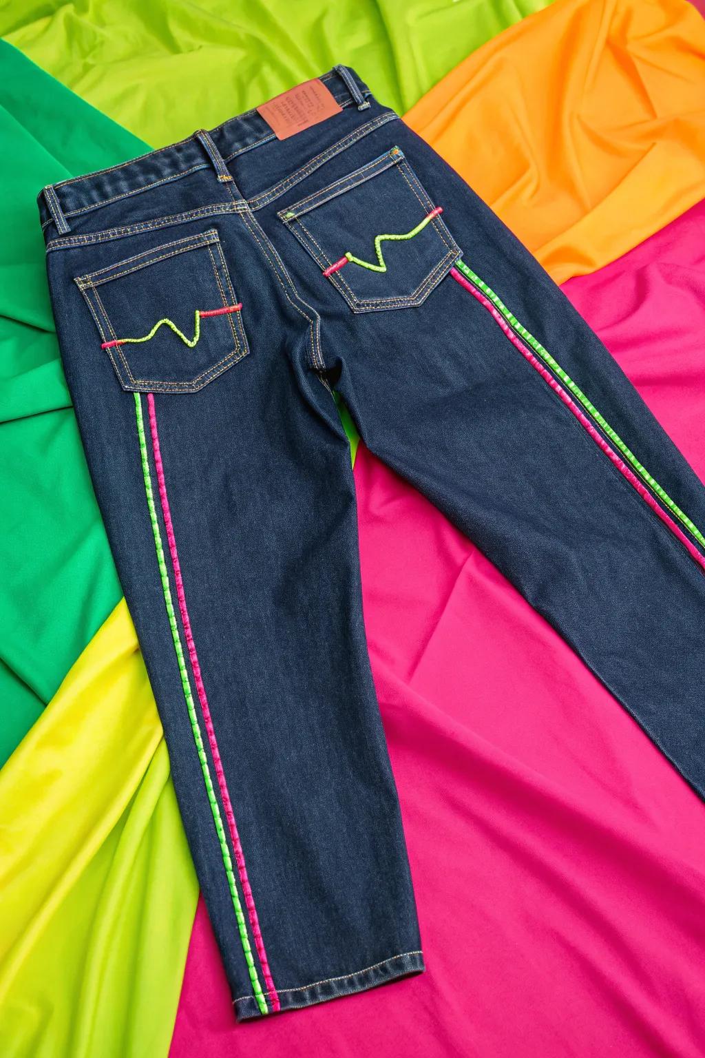 Neon topstitching adds a subtle yet vibrant detail to denim.