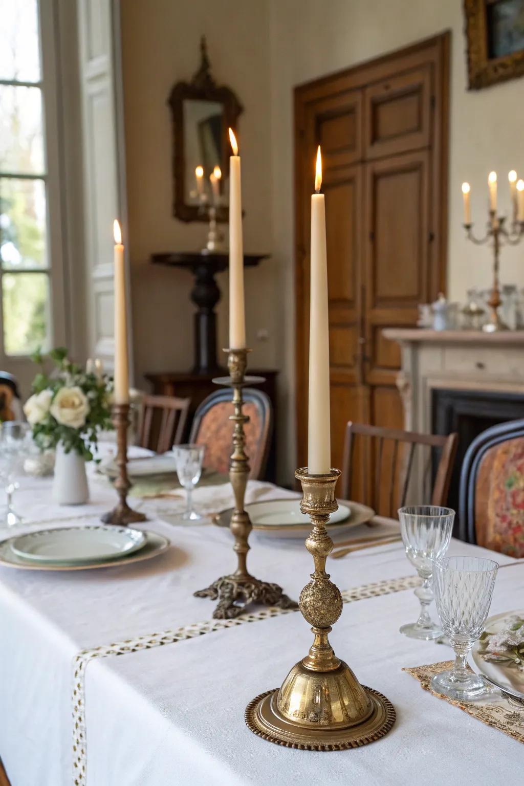 Taper candles in antique holders add elegance and height to this French table.