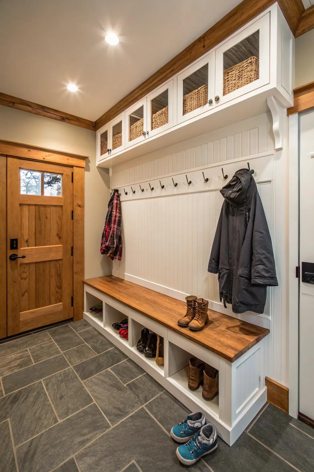 Mudroom featuring bright white board-and-batten paneling.