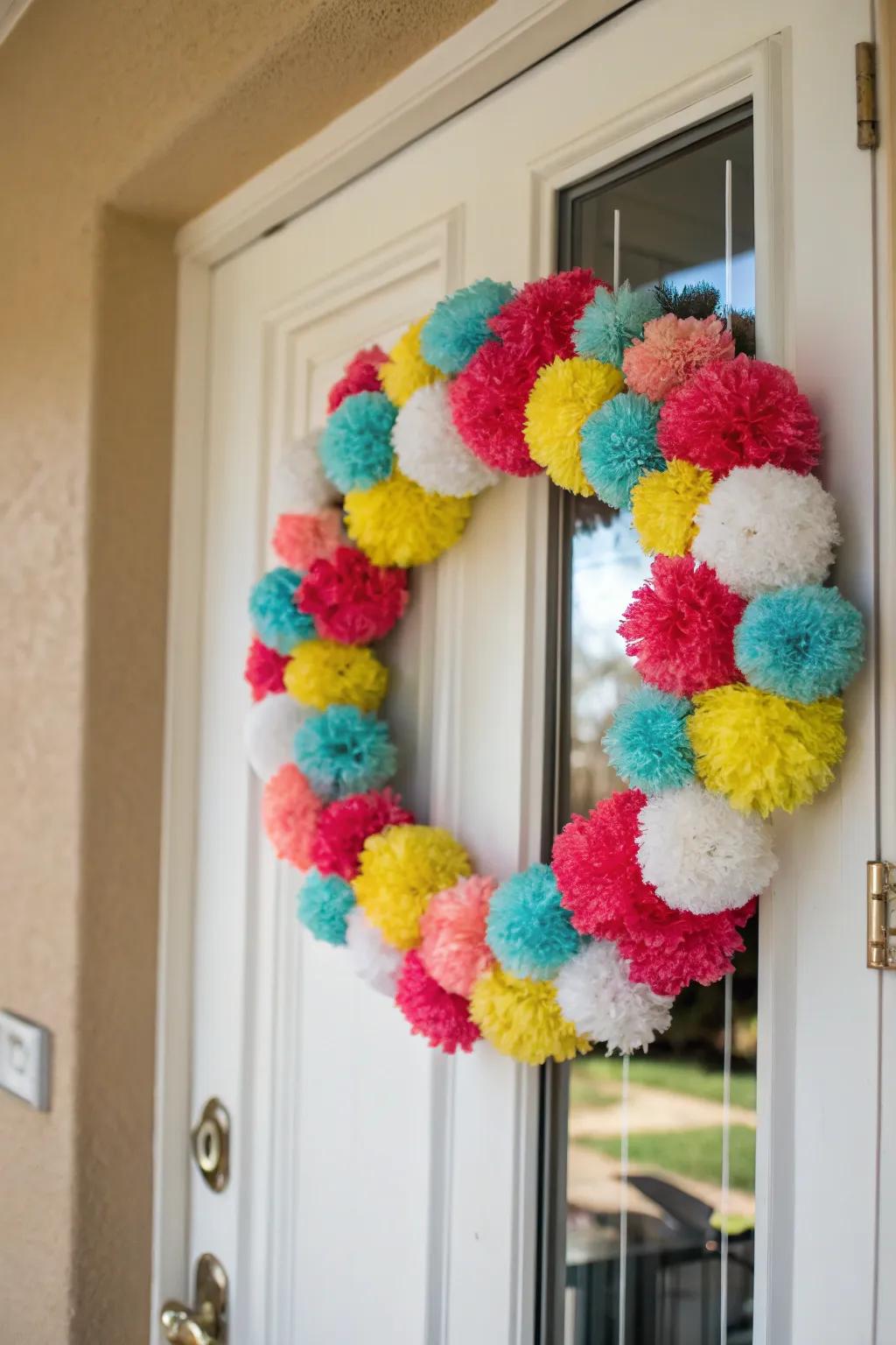 A cheerful pom-pom wreath adds fun and color.