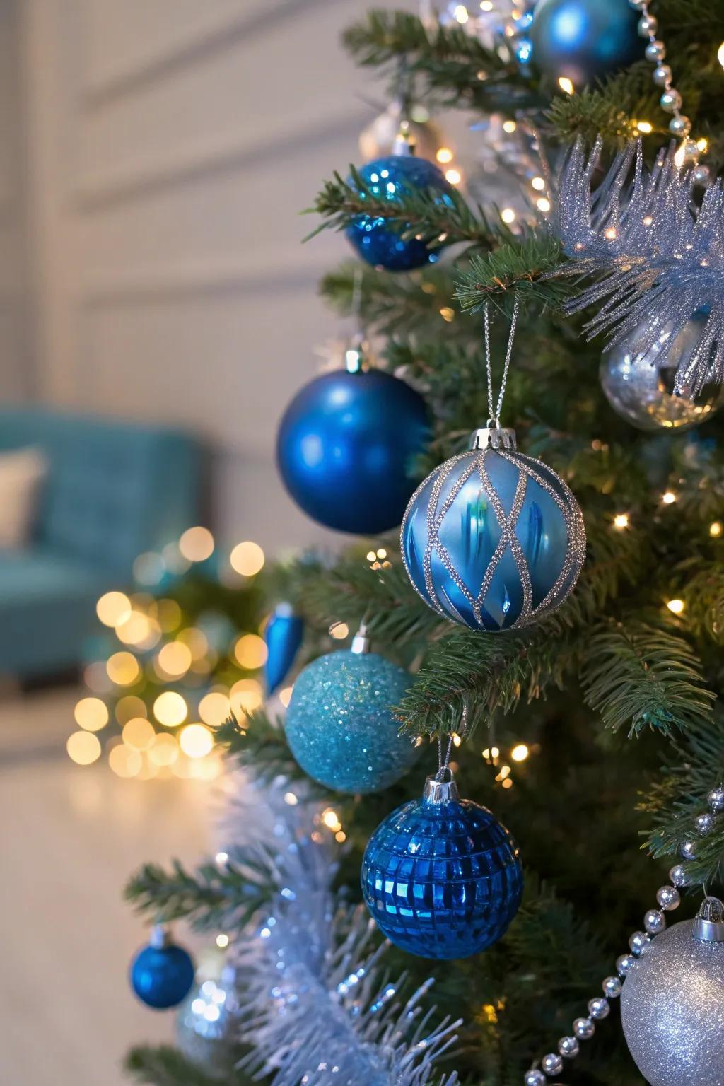 A beautifully decorated Christmas tree featuring a variety of blue ornaments.