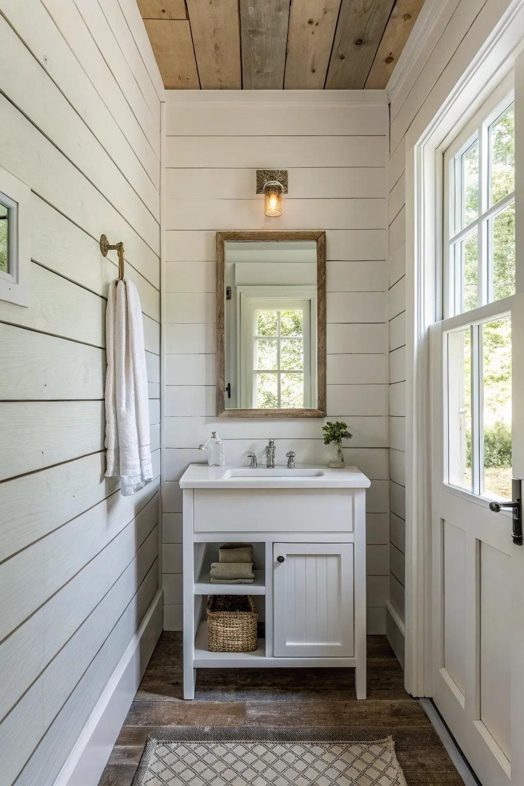 A farmhouse bathroom featuring shiplap walls and a minimalist vanity design.