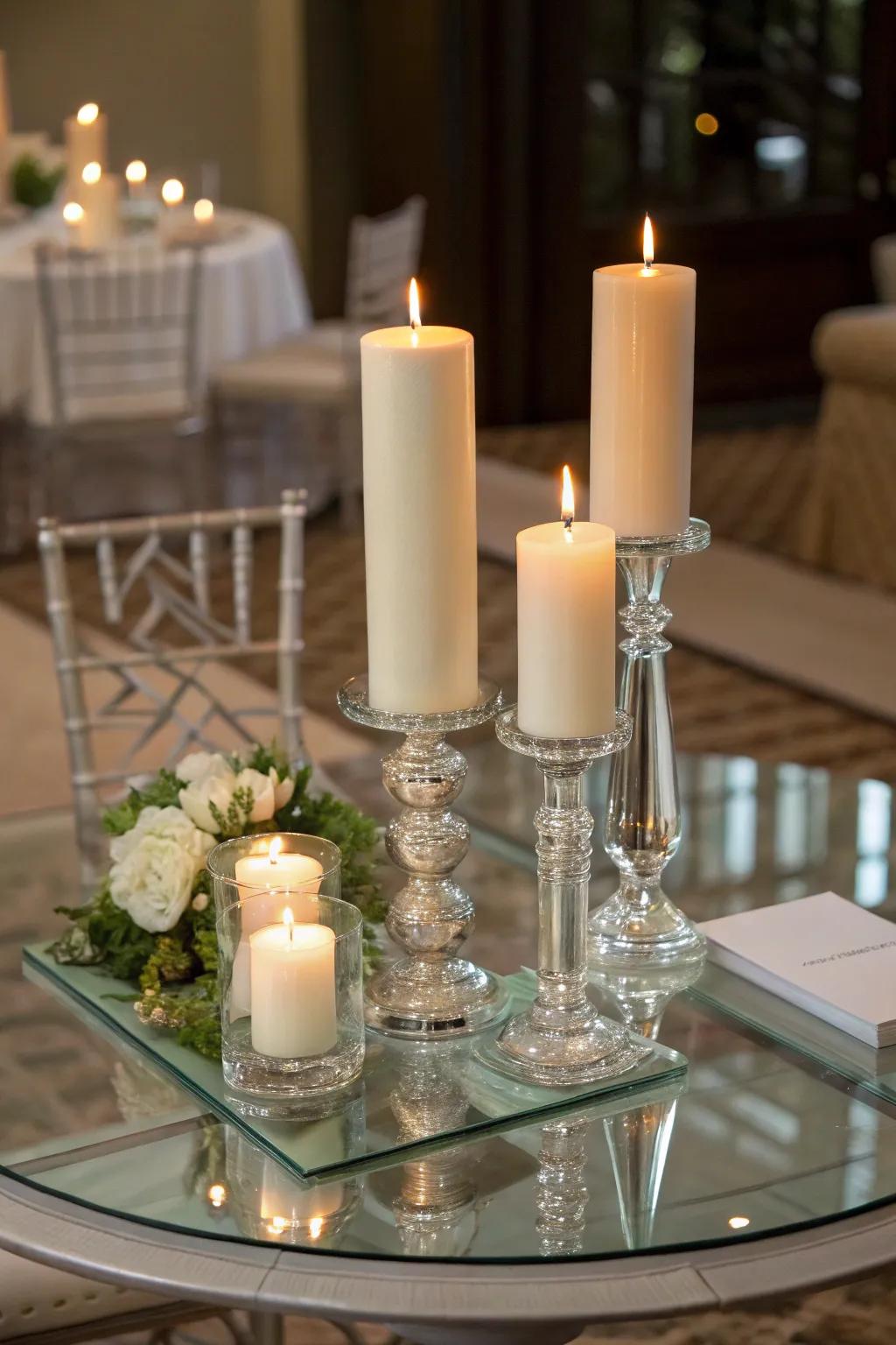 Candles of varying heights adding warmth to a glass dining table.