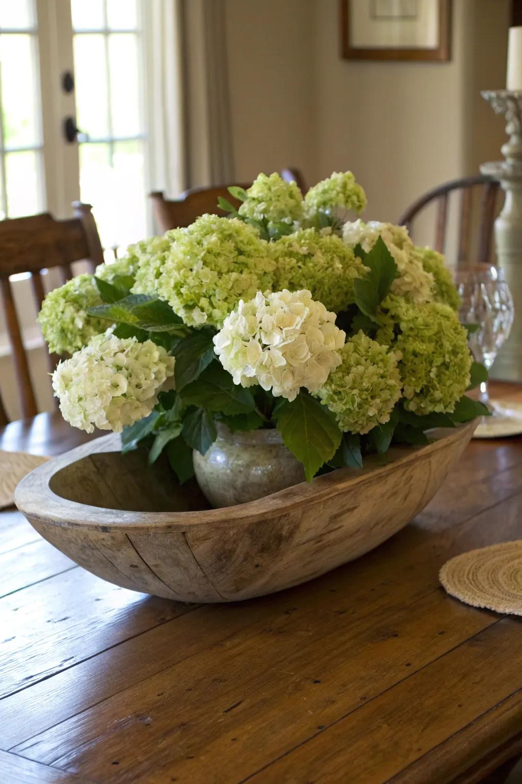 A dough bowl filled with hydrangeas makes a stunning centerpiece.