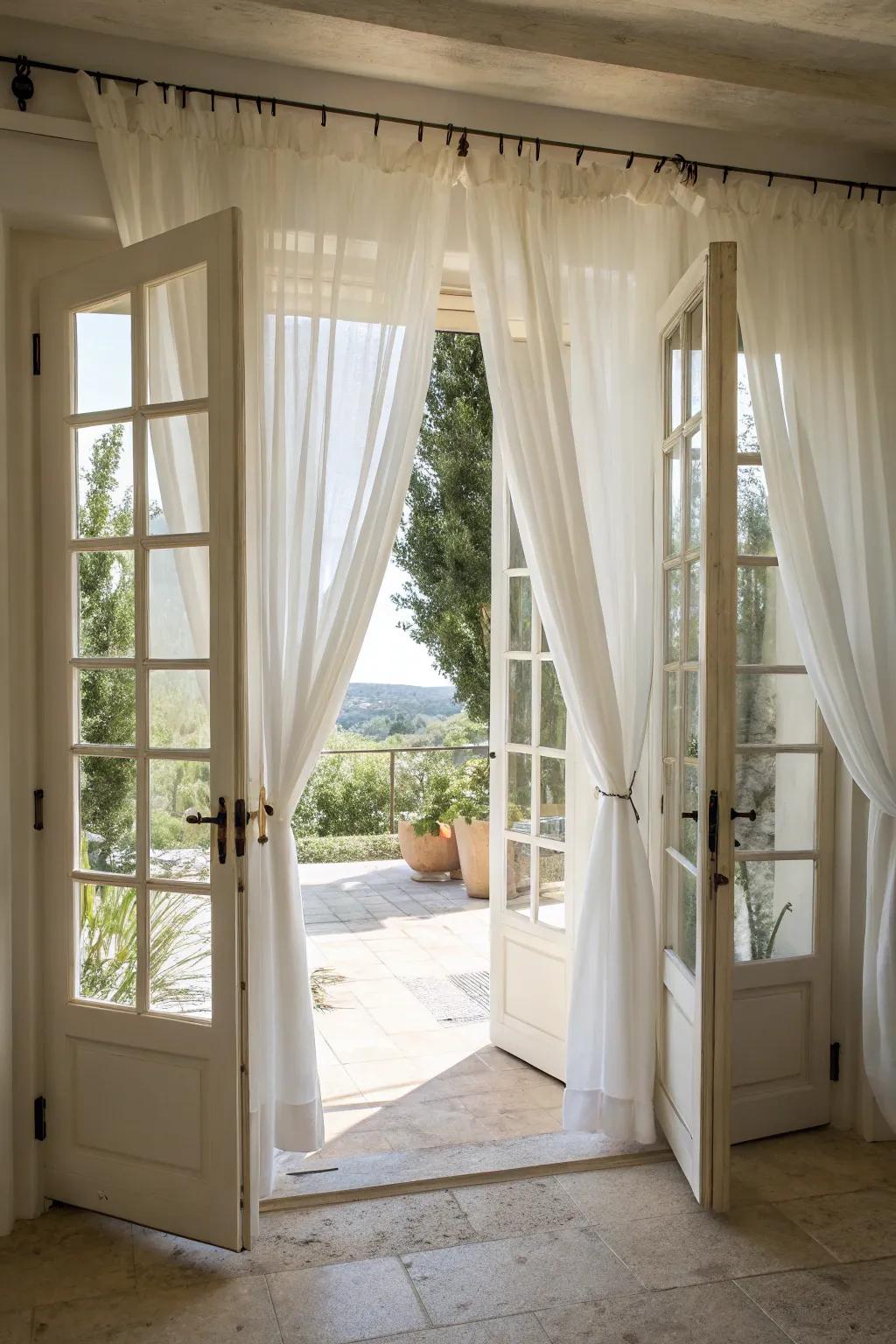 Crisp white curtains adding brightness and freshness to French doors.