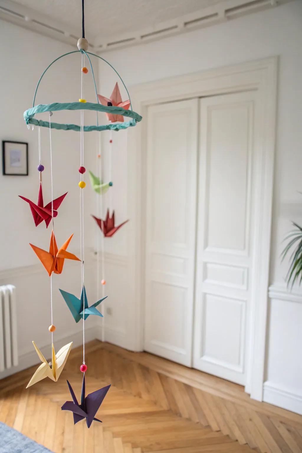 A colorful paper crane mobile adding vibrancy to minimalist decor.