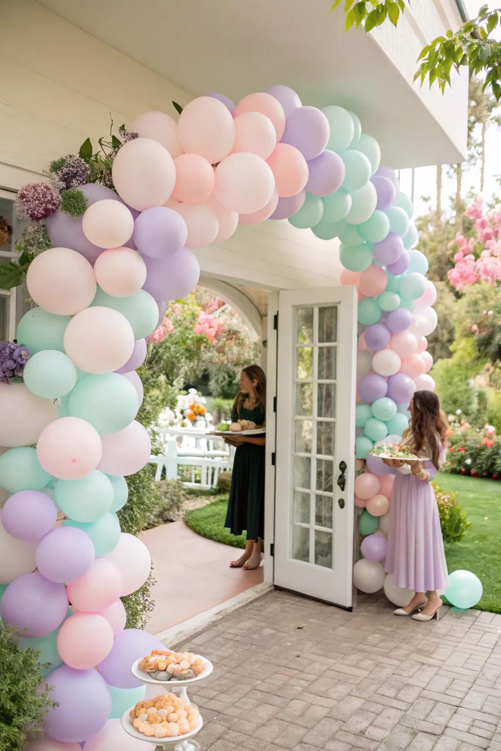 Pastel balloon arches add a whimsical touch to your bridal shower.