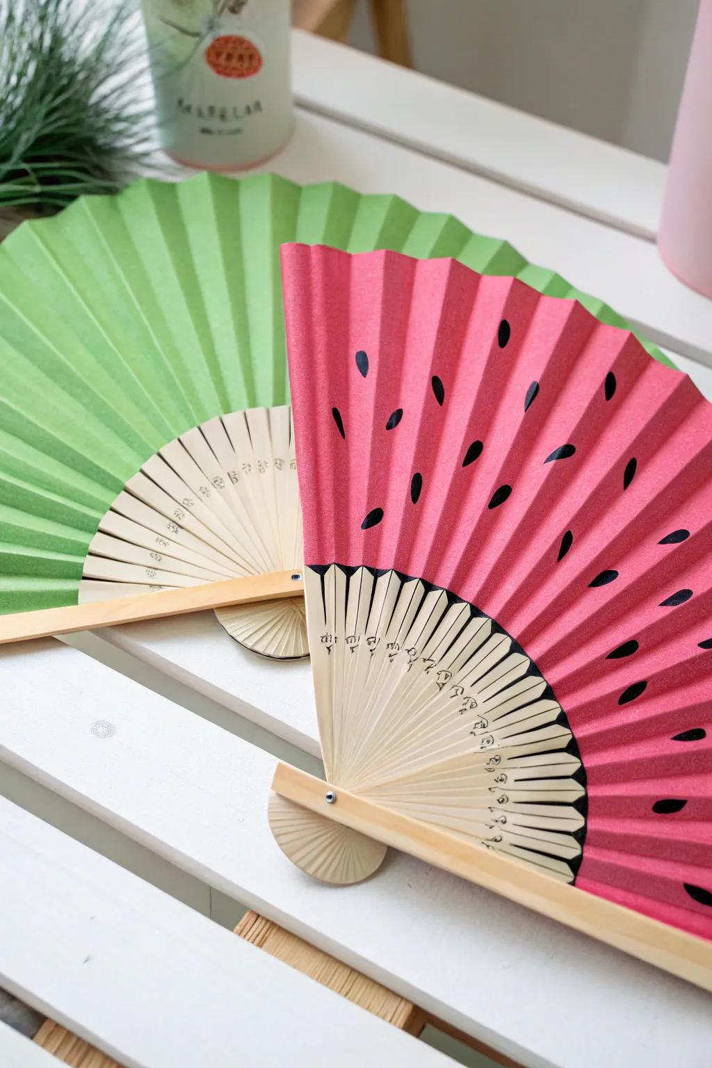 Embrace summer with a splash of color! This watermelon-themed fan is your perfect picnic companion. 🍉