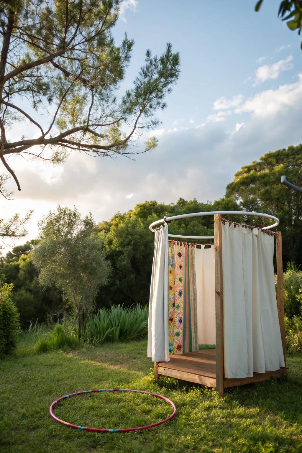 A creative shower enclosure using a hula hoop and curtains.