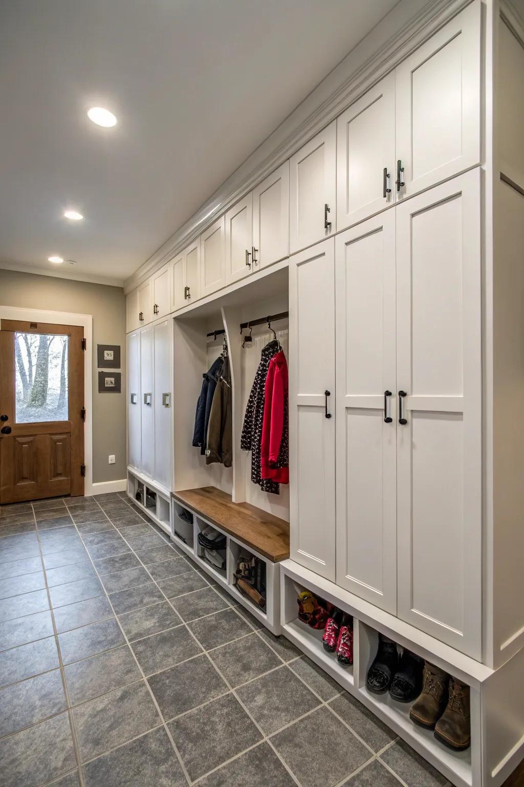 Tall storage cabinets in a garage mudroom hide clutter and keep things tidy.