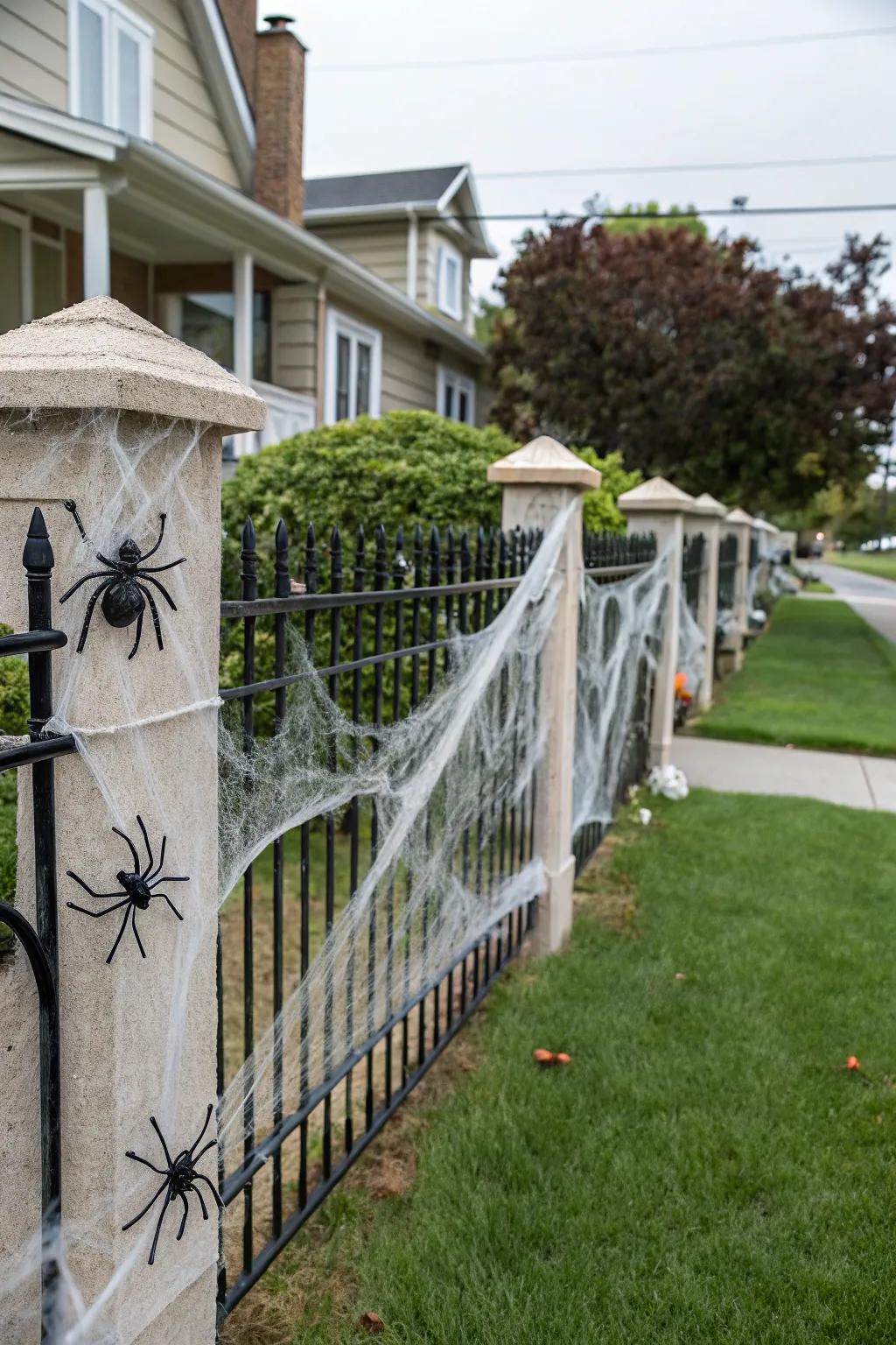 Cobwebs and spiders create a creepy fence.