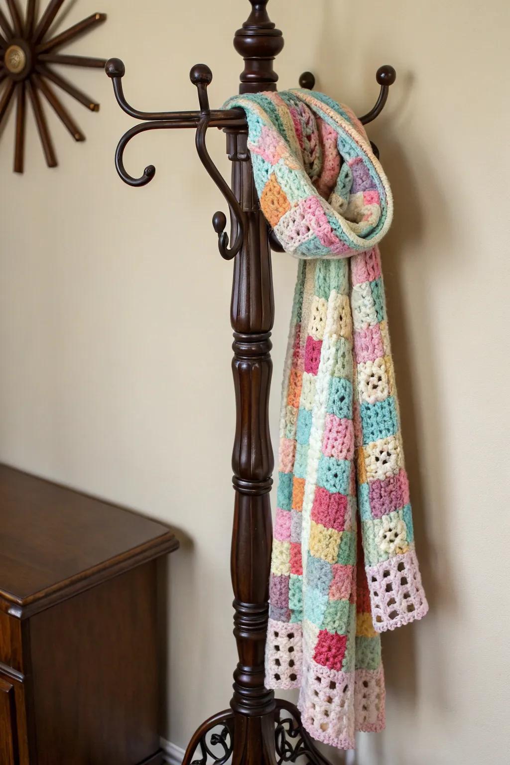 A vibrant scarf made from granny squares, ideal for adding color to winter outfits.