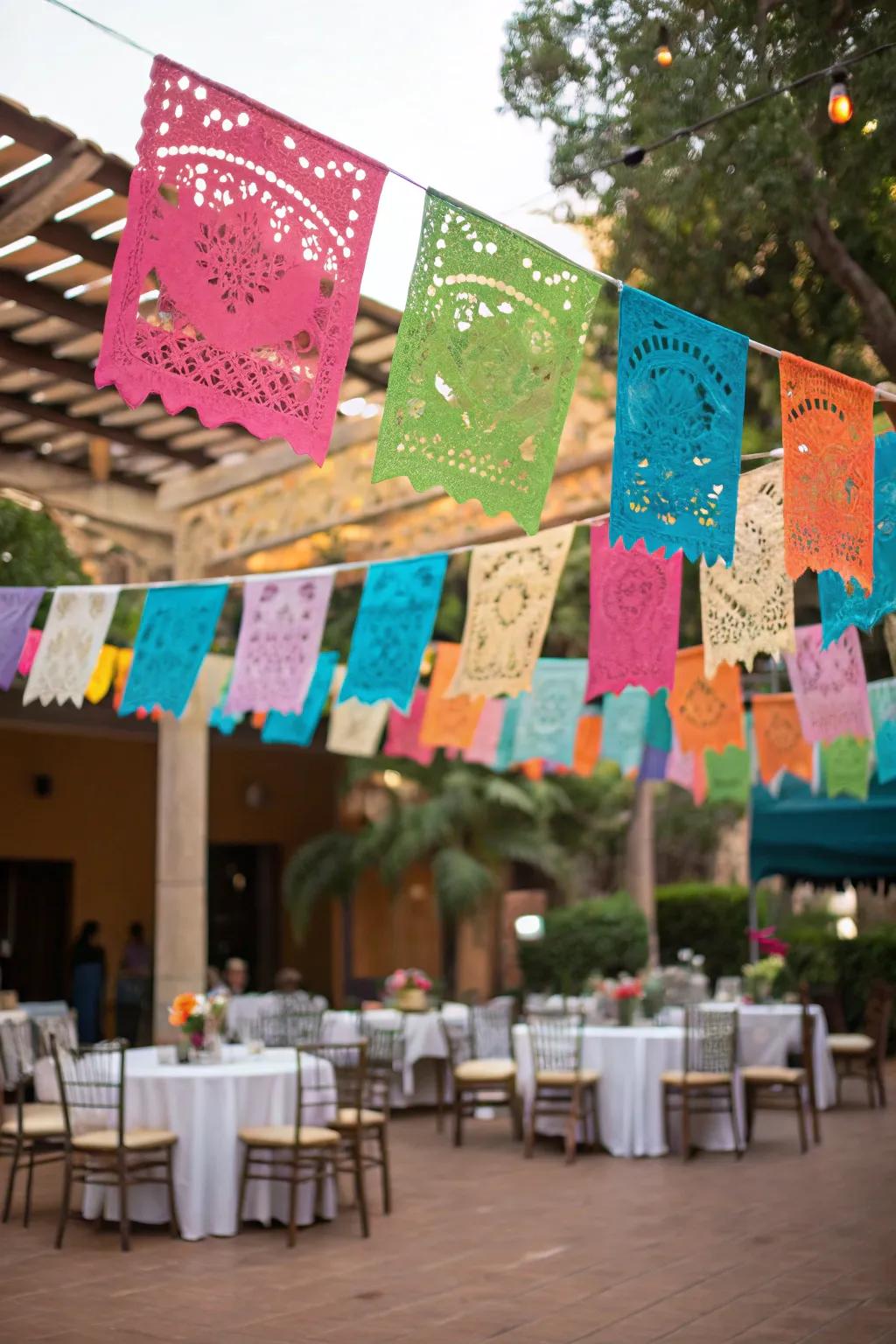 Vibrant papel picado banners adding festive charm to the wedding venue.