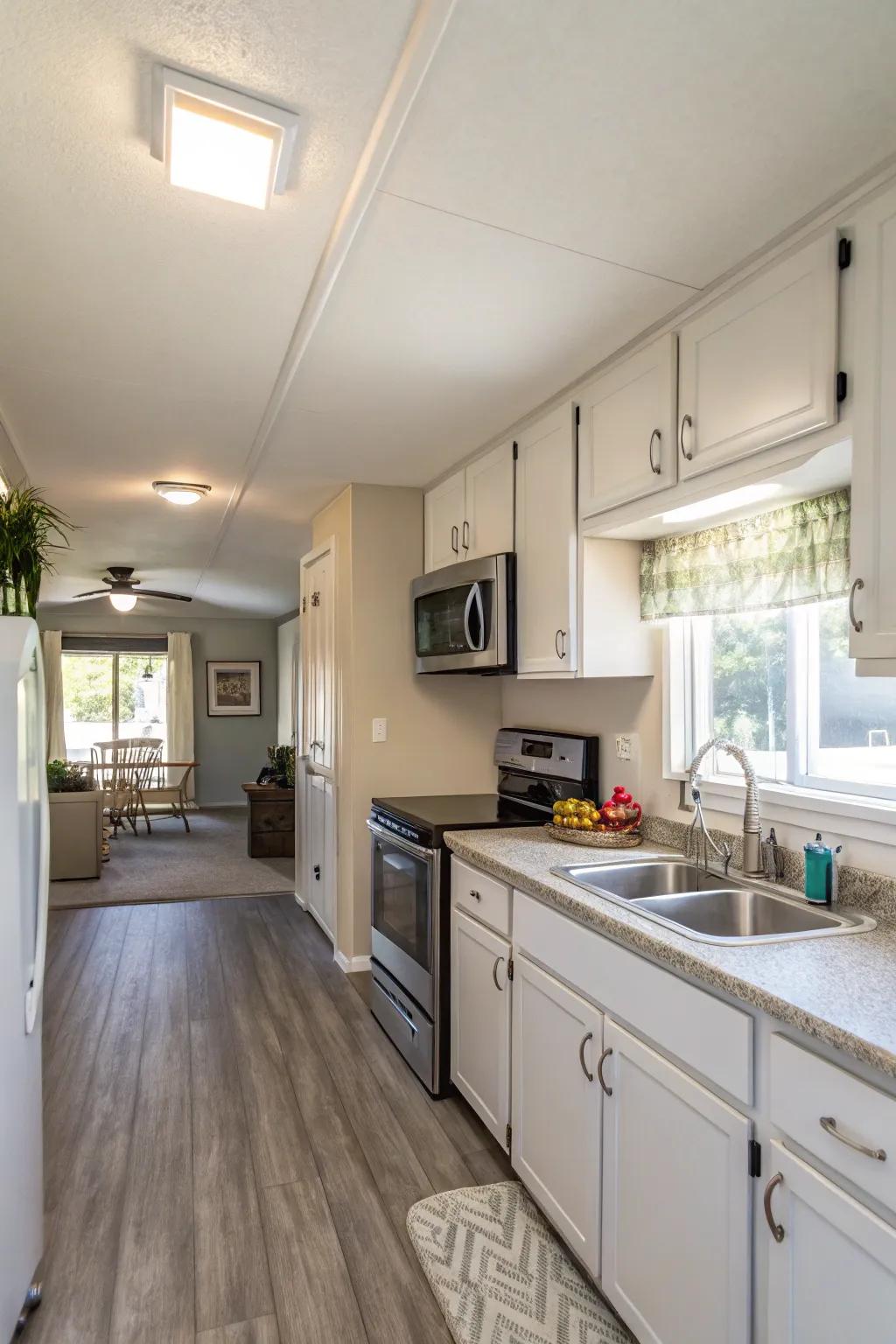 A freshly painted mobile home kitchen that feels bright and open.