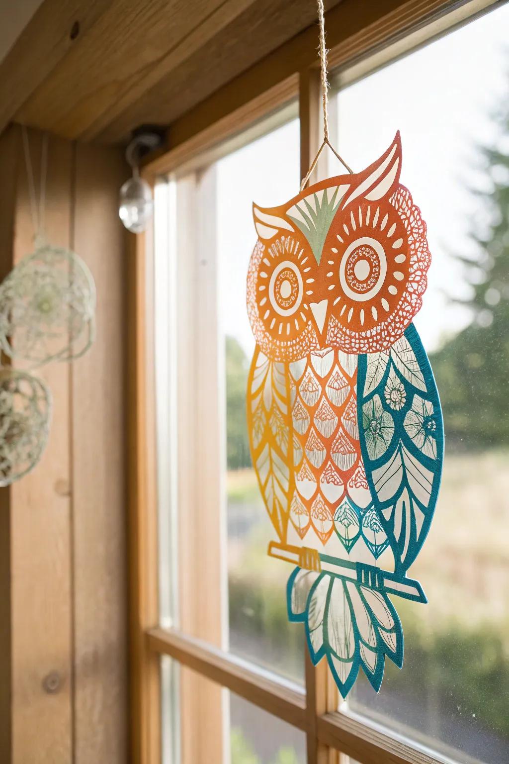 Illuminate your space with the enchanting glow of a handcrafted owl suncatcher, where artistry meets sunlight.