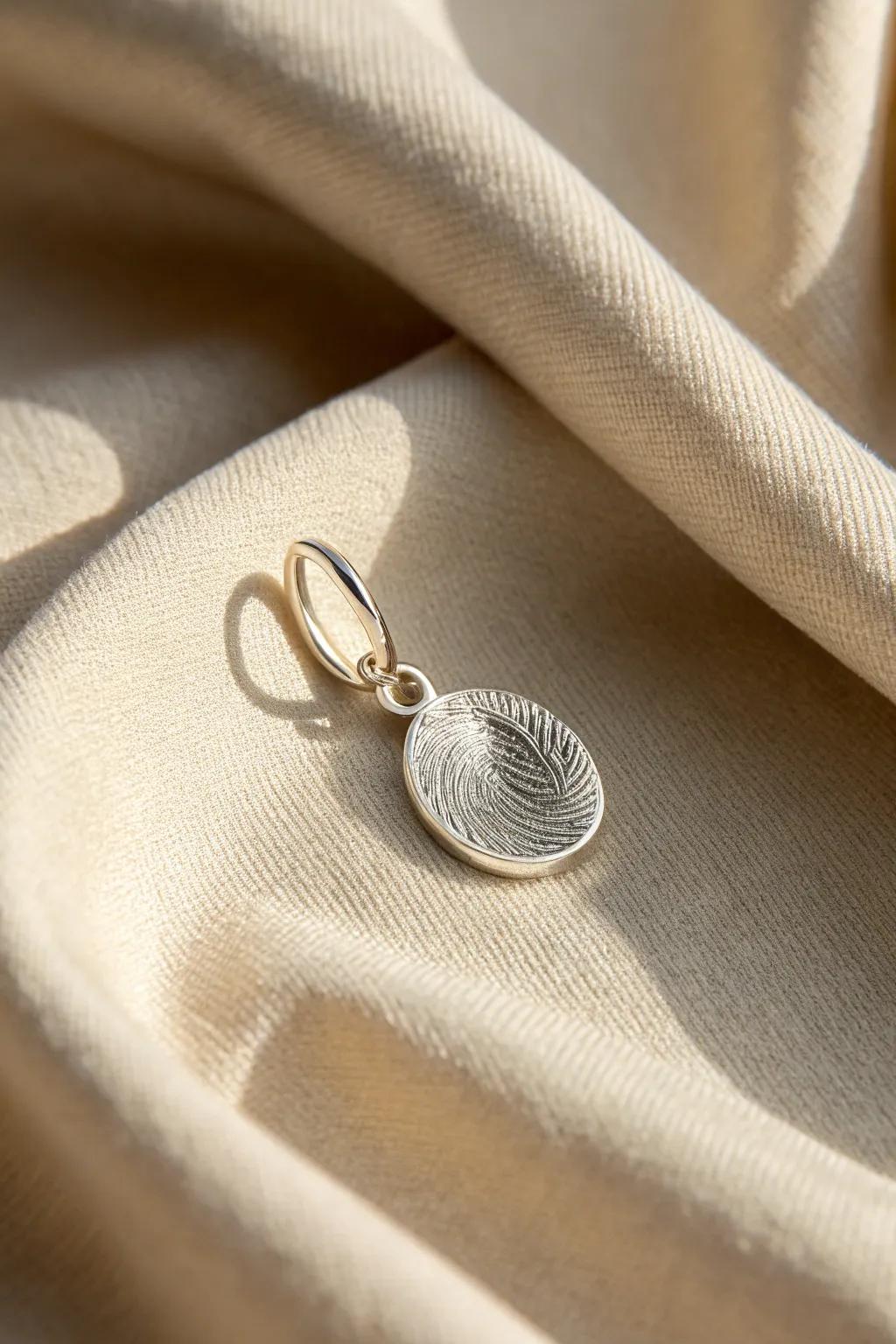 Keep loved ones close with personalized fingerprint charms.