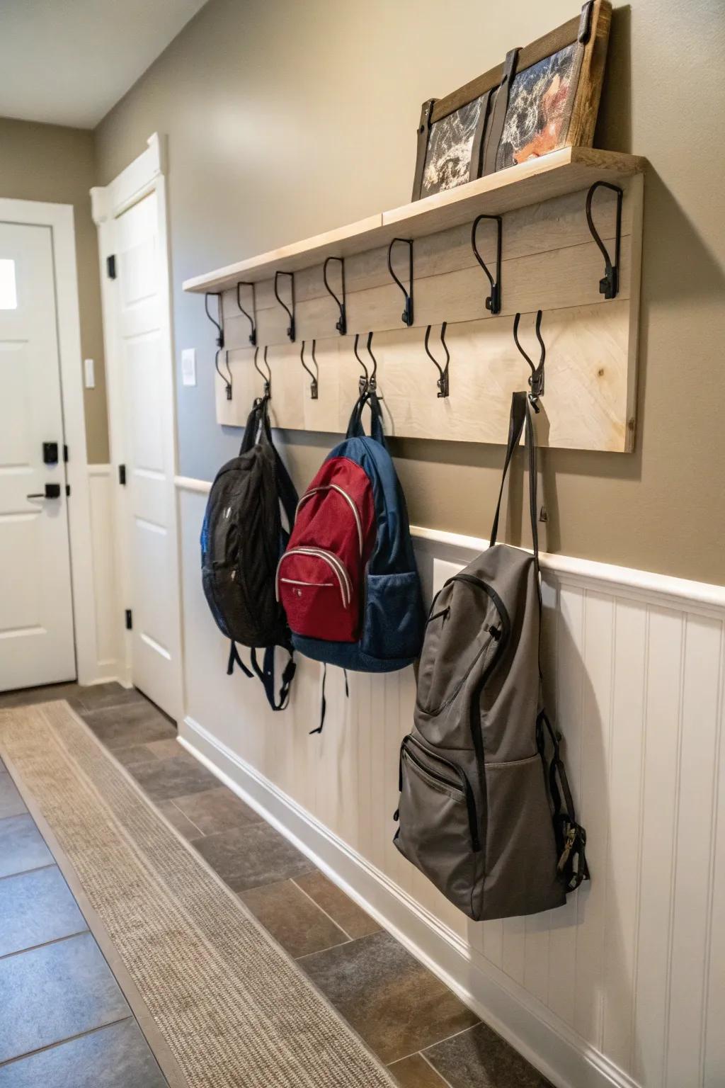 A wall-mounted shelf with hooks combines storage and style.