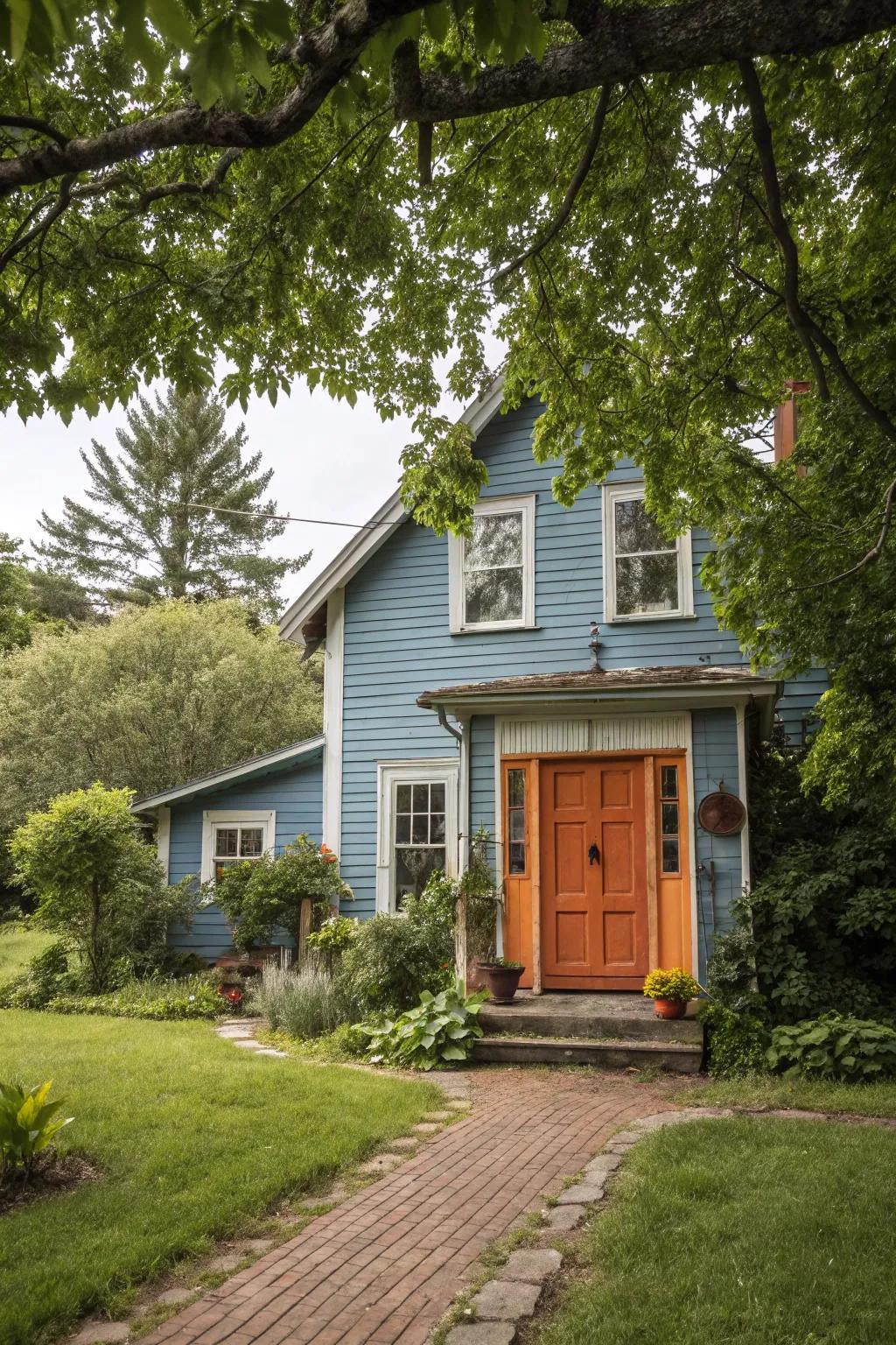 Orange doors offer a welcoming warmth to blue homes.