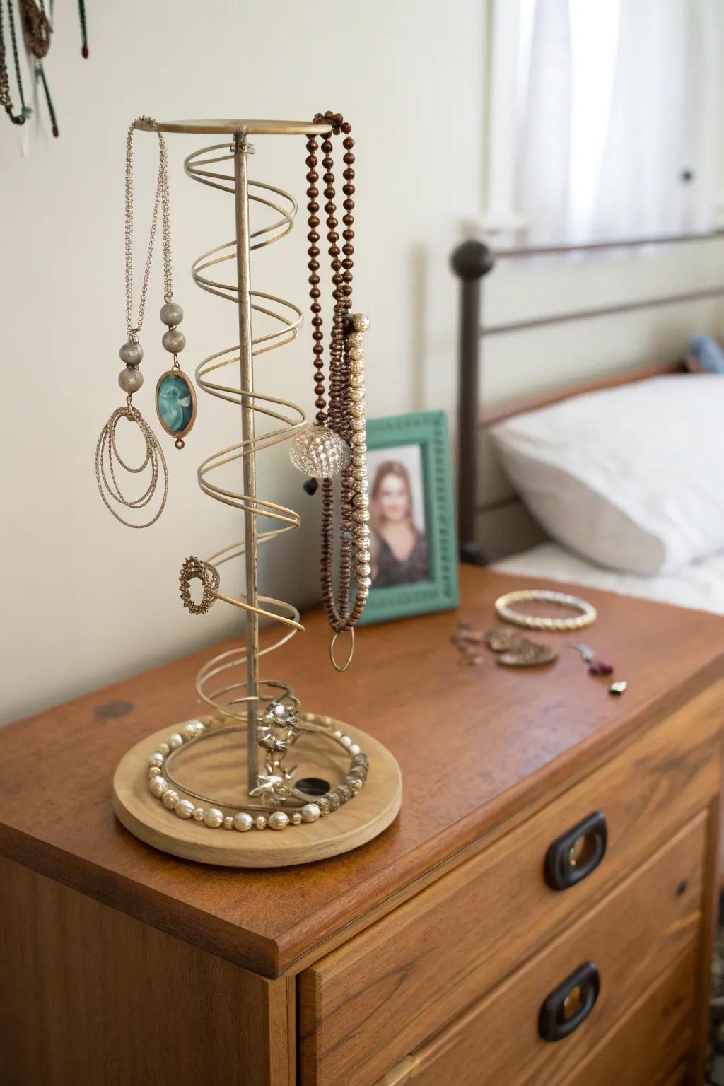 A practical and stylish way to organize jewelry using a bed spring.