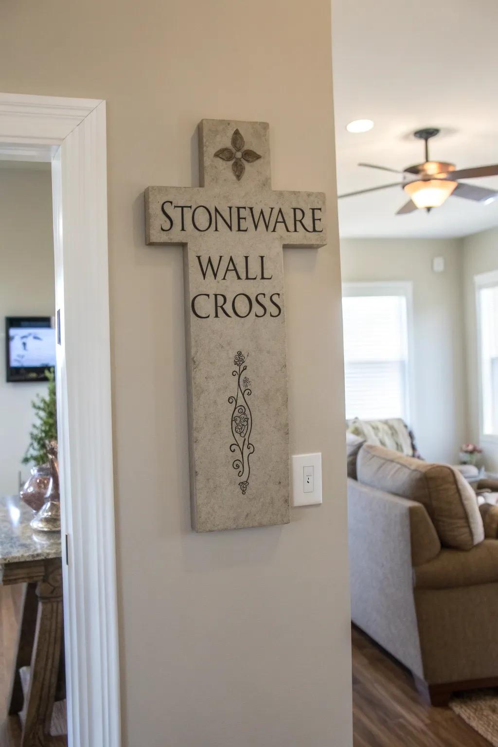 A stoneware wall cross with embossed quotes.