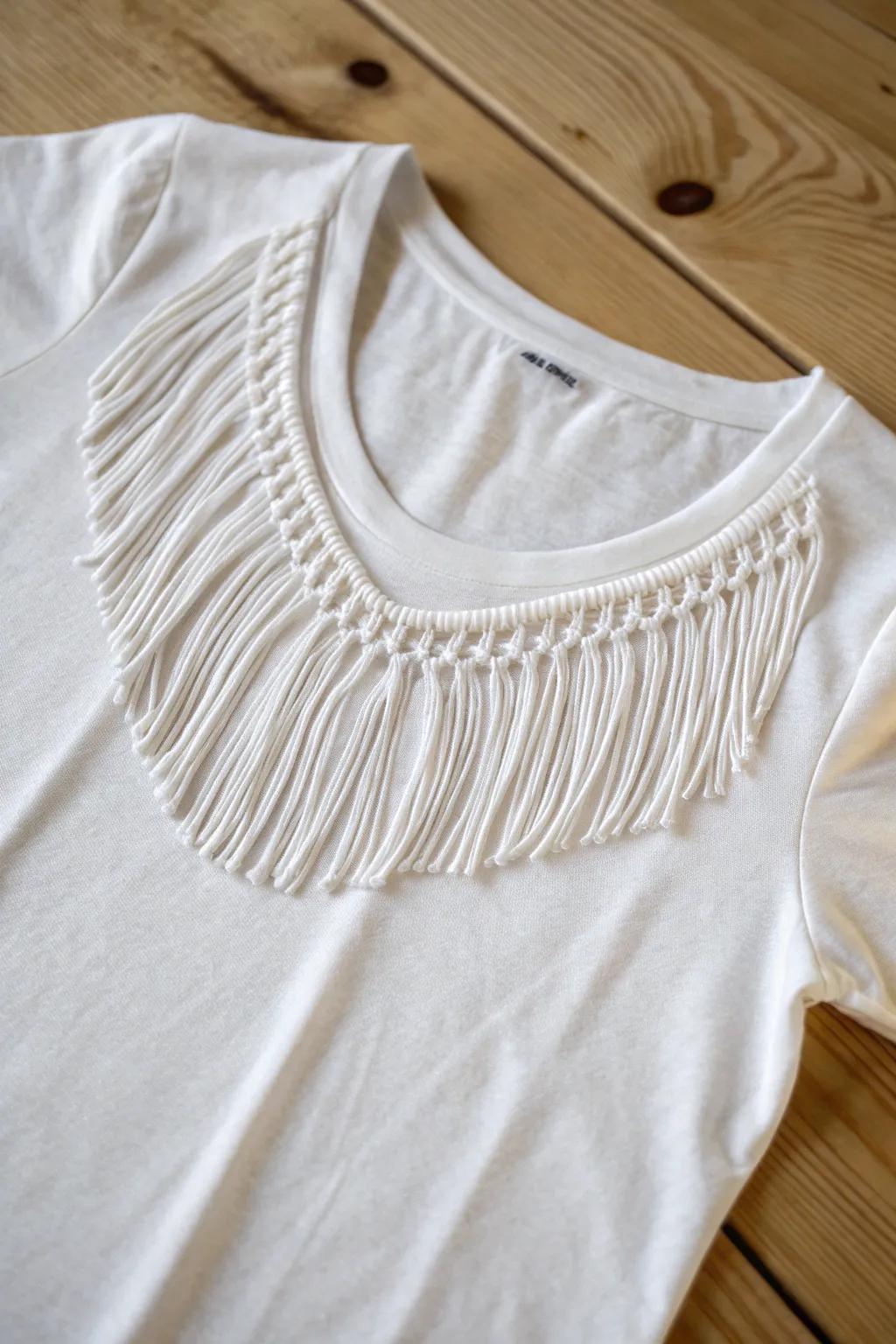 Transform your tee with a touch of boho elegance: the fringed neckline.