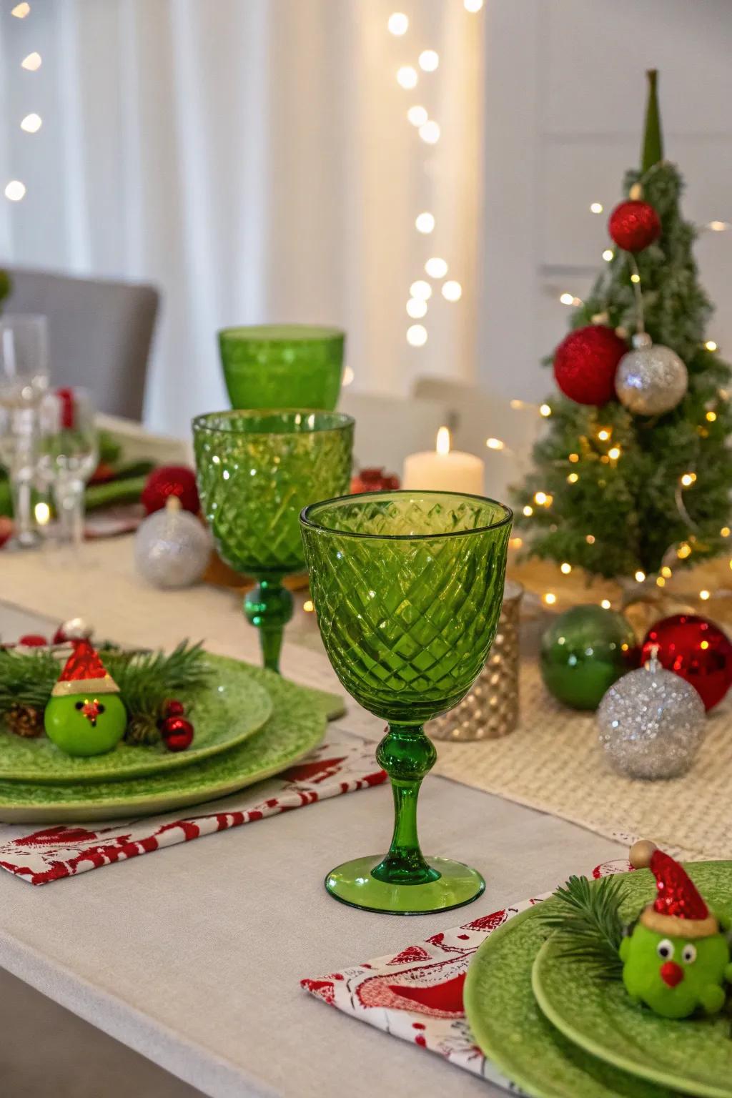 Green glassware adding elegance to the Grinch-themed table setting.