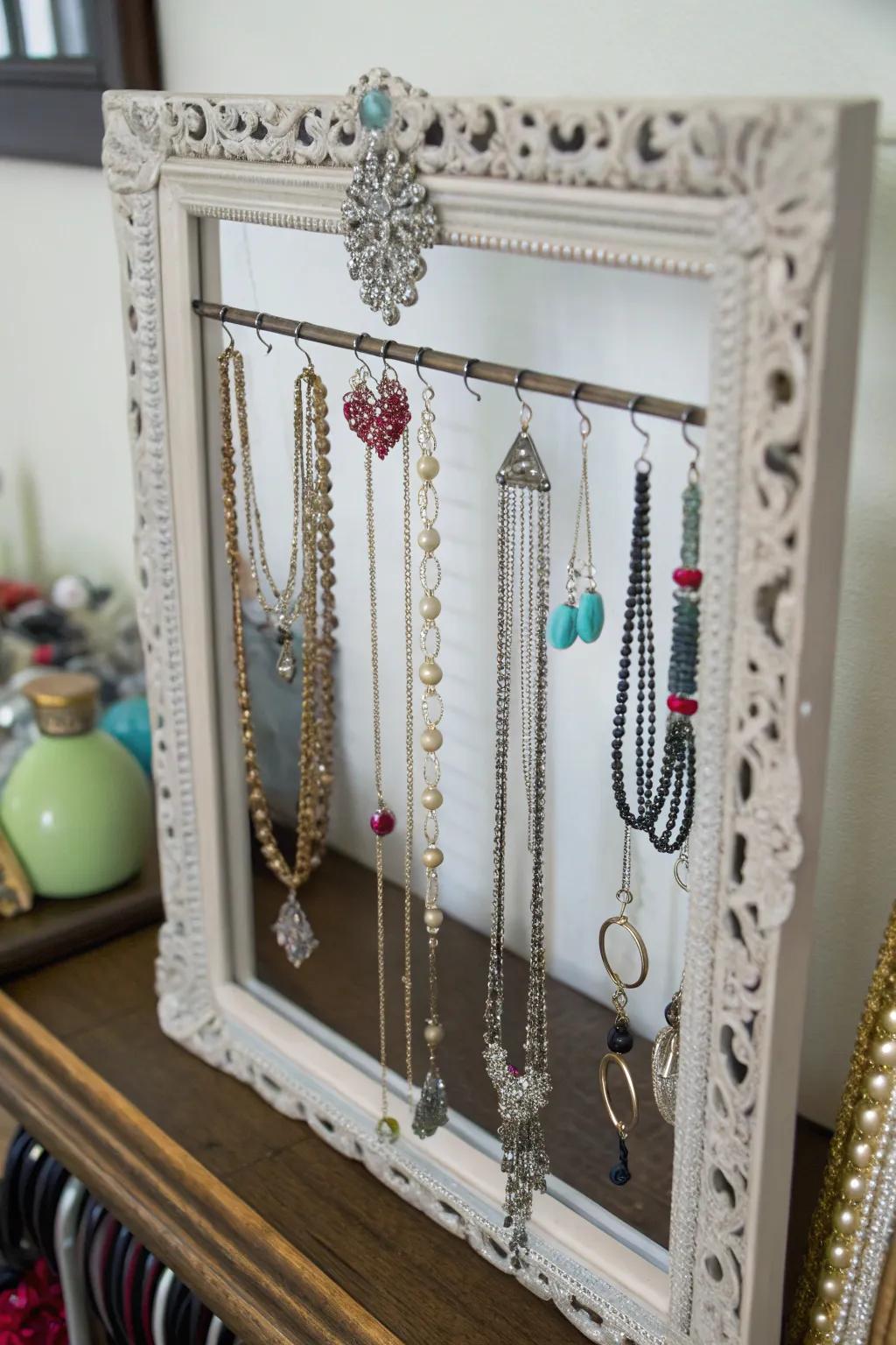 A stylish jewelry organizer crafted from an old mirror frame.