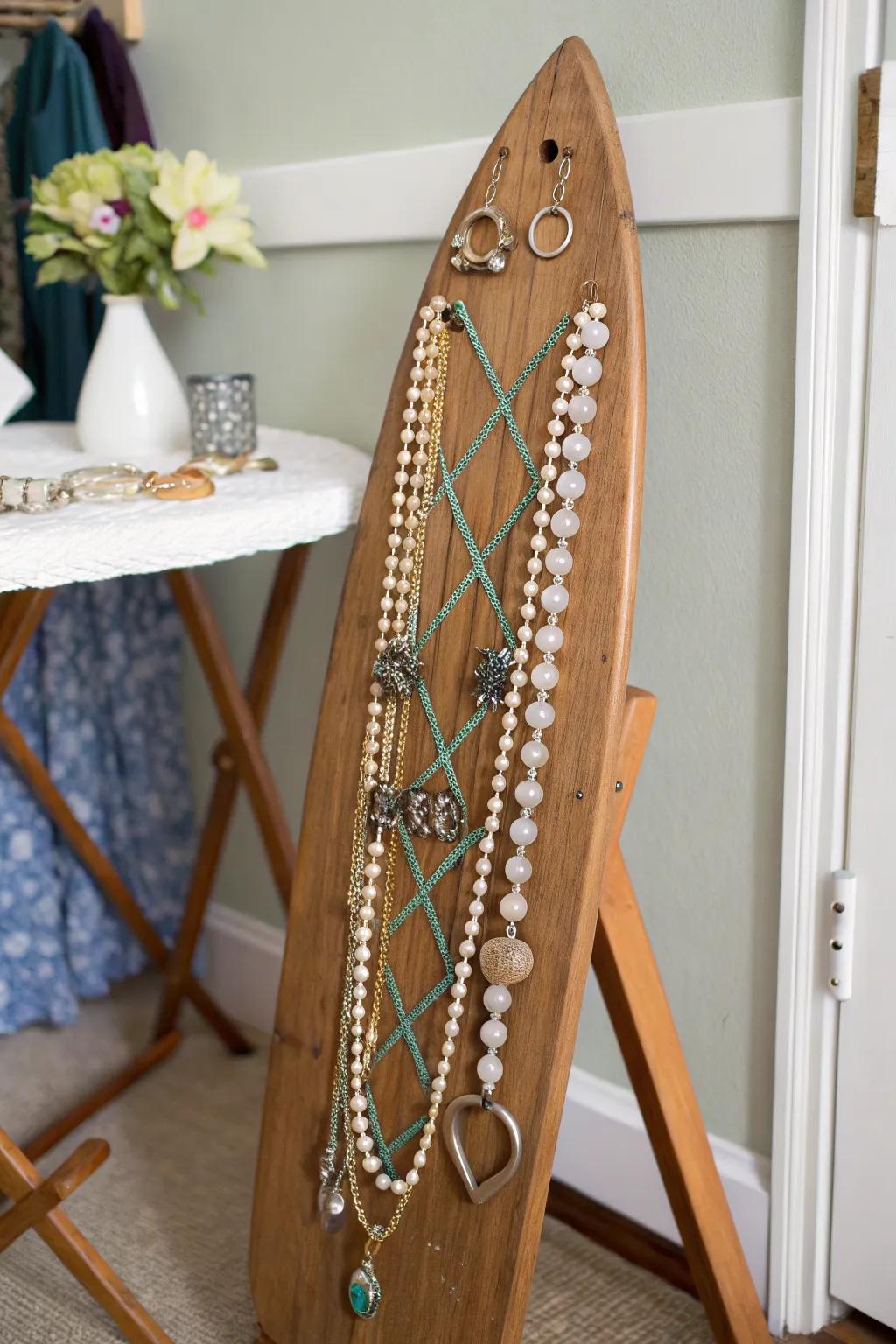 Showcase your jewelry on a stylish wooden ironing board hanger.