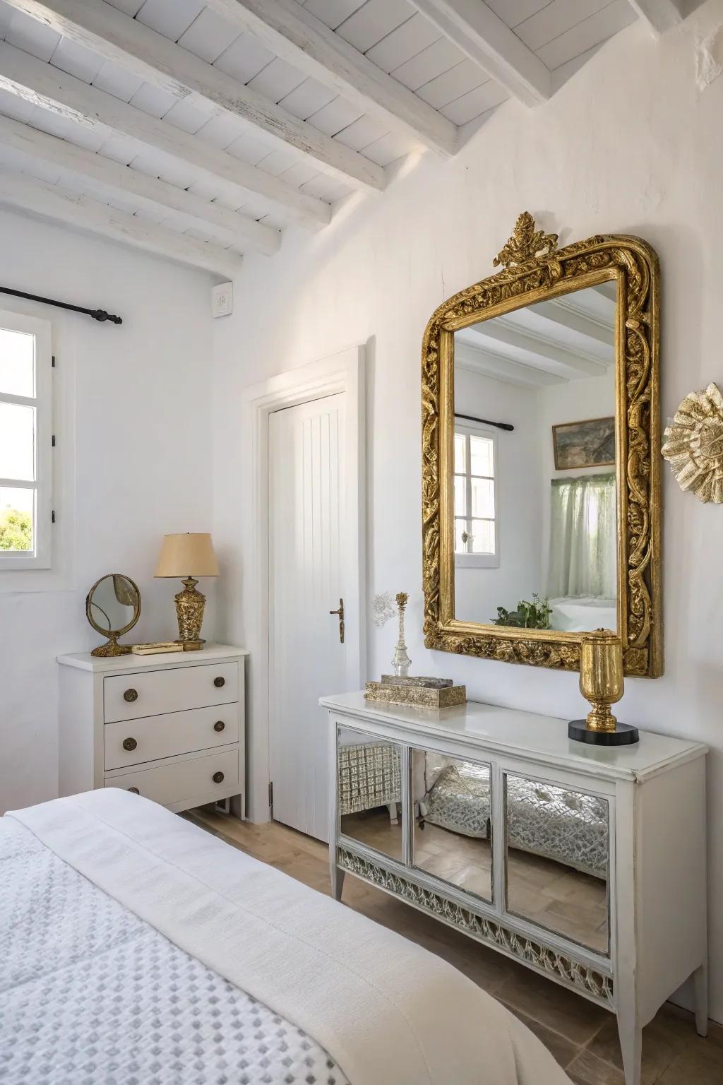 Metallic accents introduce a hint of luxury in a small white bedroom.