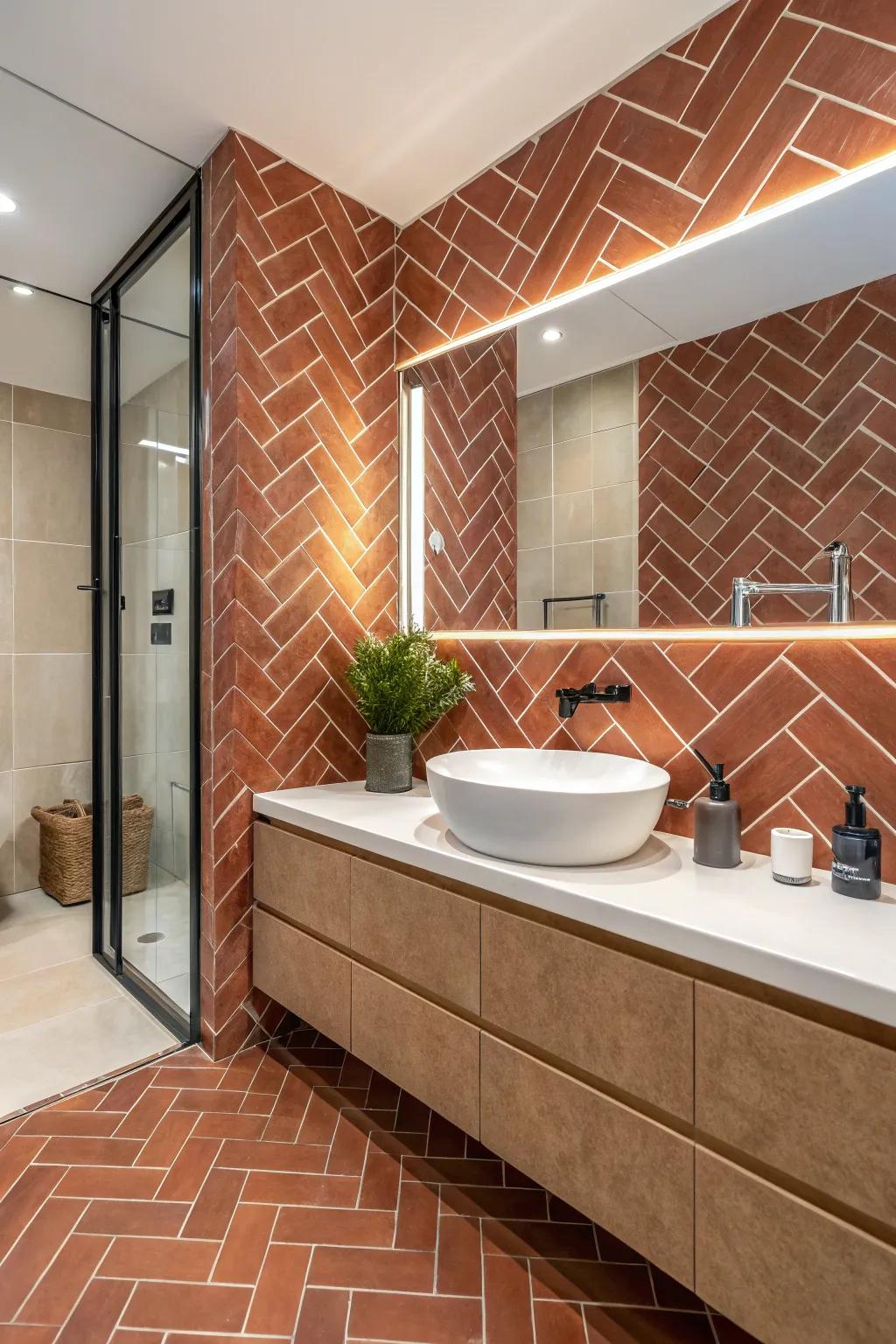 Modern terra cotta subway tiles arranged in a chic herringbone pattern.