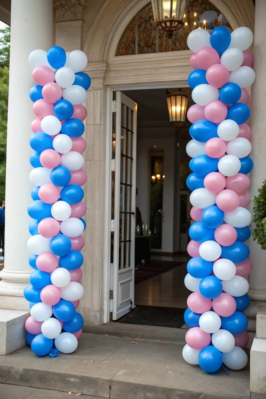 Elegant balloon columns framing a doorway.