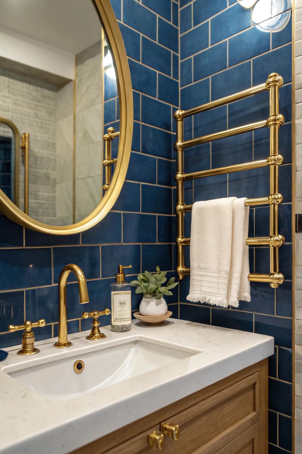 Brushed brass fixtures against deep blue tiles for a striking contrast.