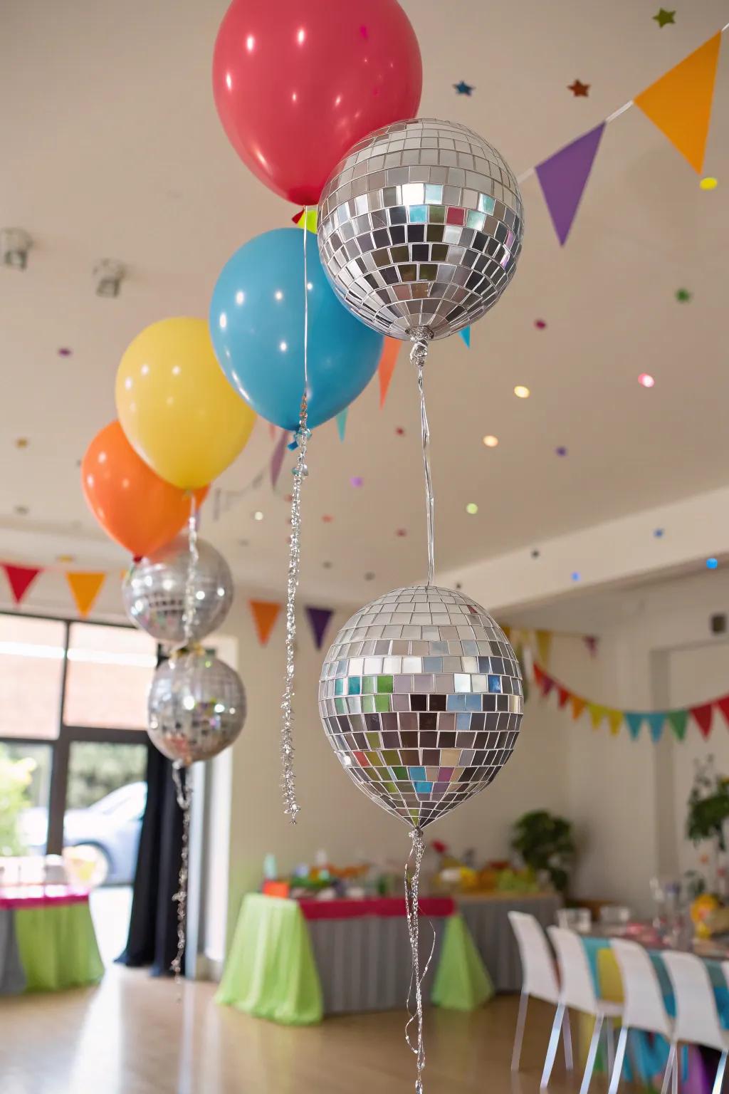 Glamorous disco balls used as eye-catching balloon weights.