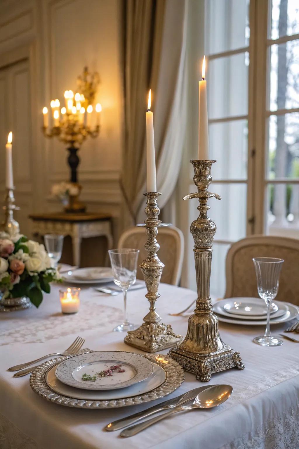 Candlelight from vintage candlesticks adds warmth and romance to a French table.