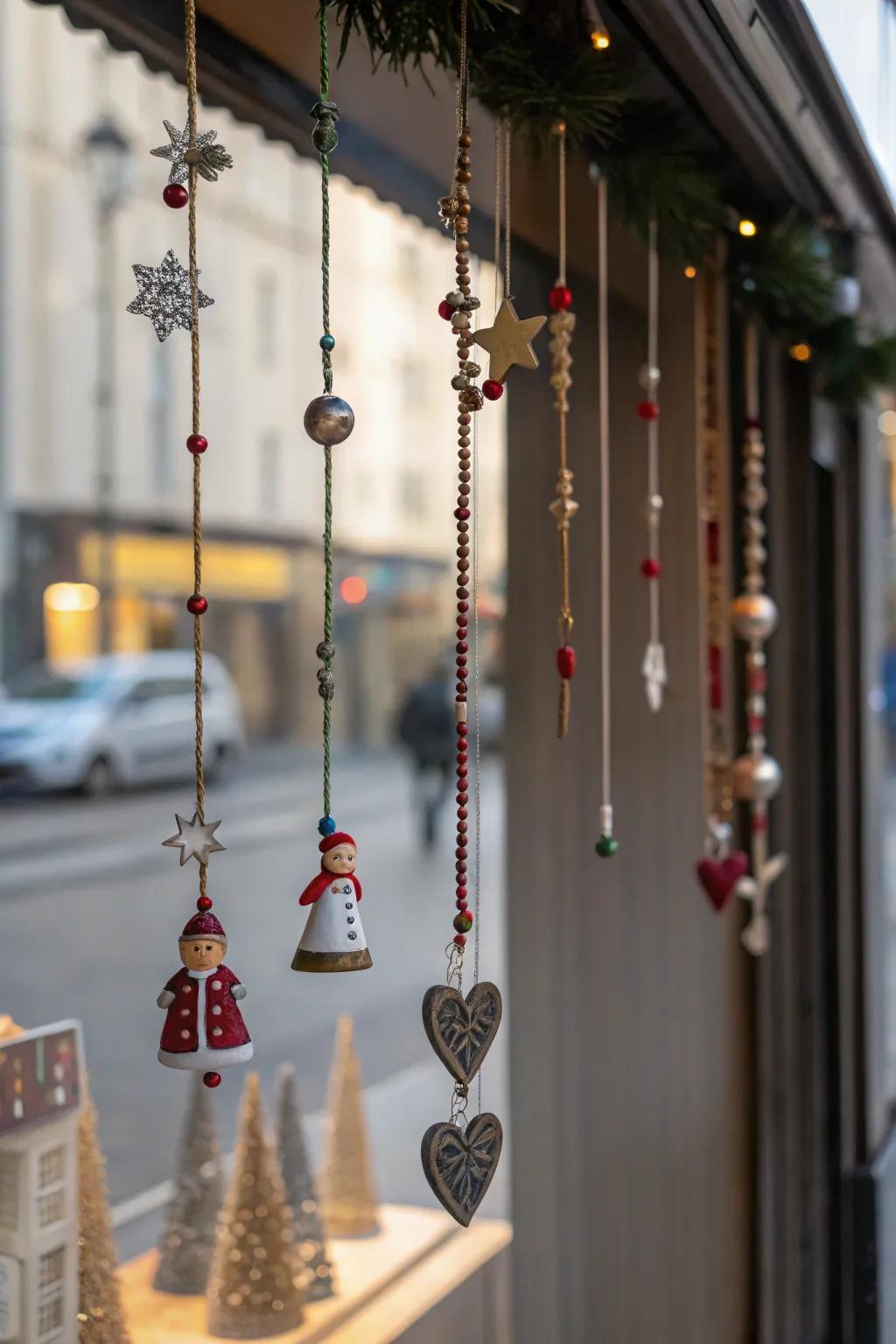 A playful display of ornaments hanging in a window.