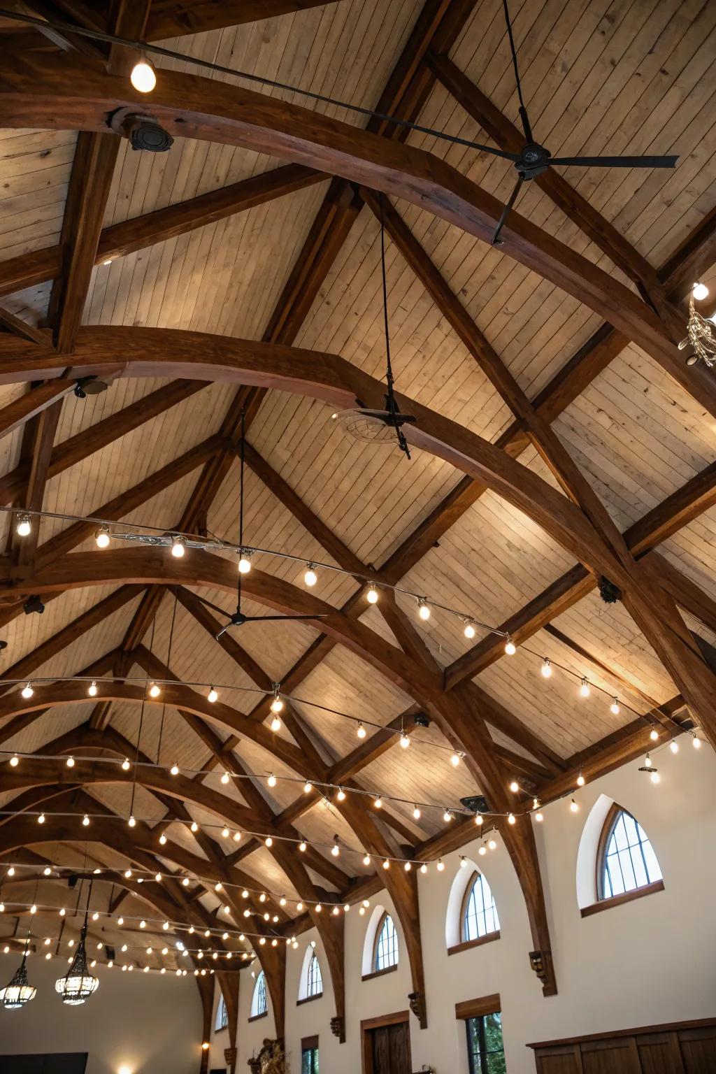 Directional lighting highlights the exposed beams of a vaulted ceiling.