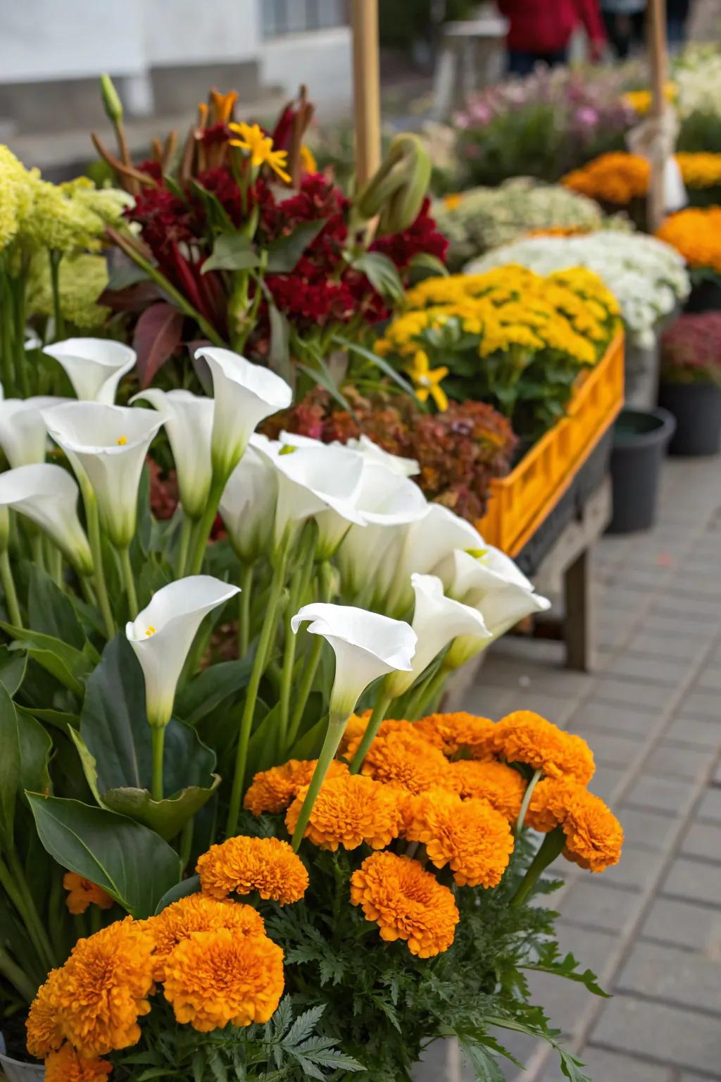 Stunning floral arrangements featuring marigolds and calla lilies.