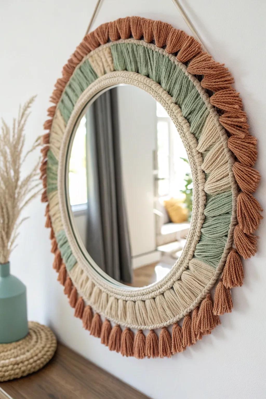 Enhance your space with the boho-chic elegance of a yarn tassel mirror, where simplicity meets artistry.