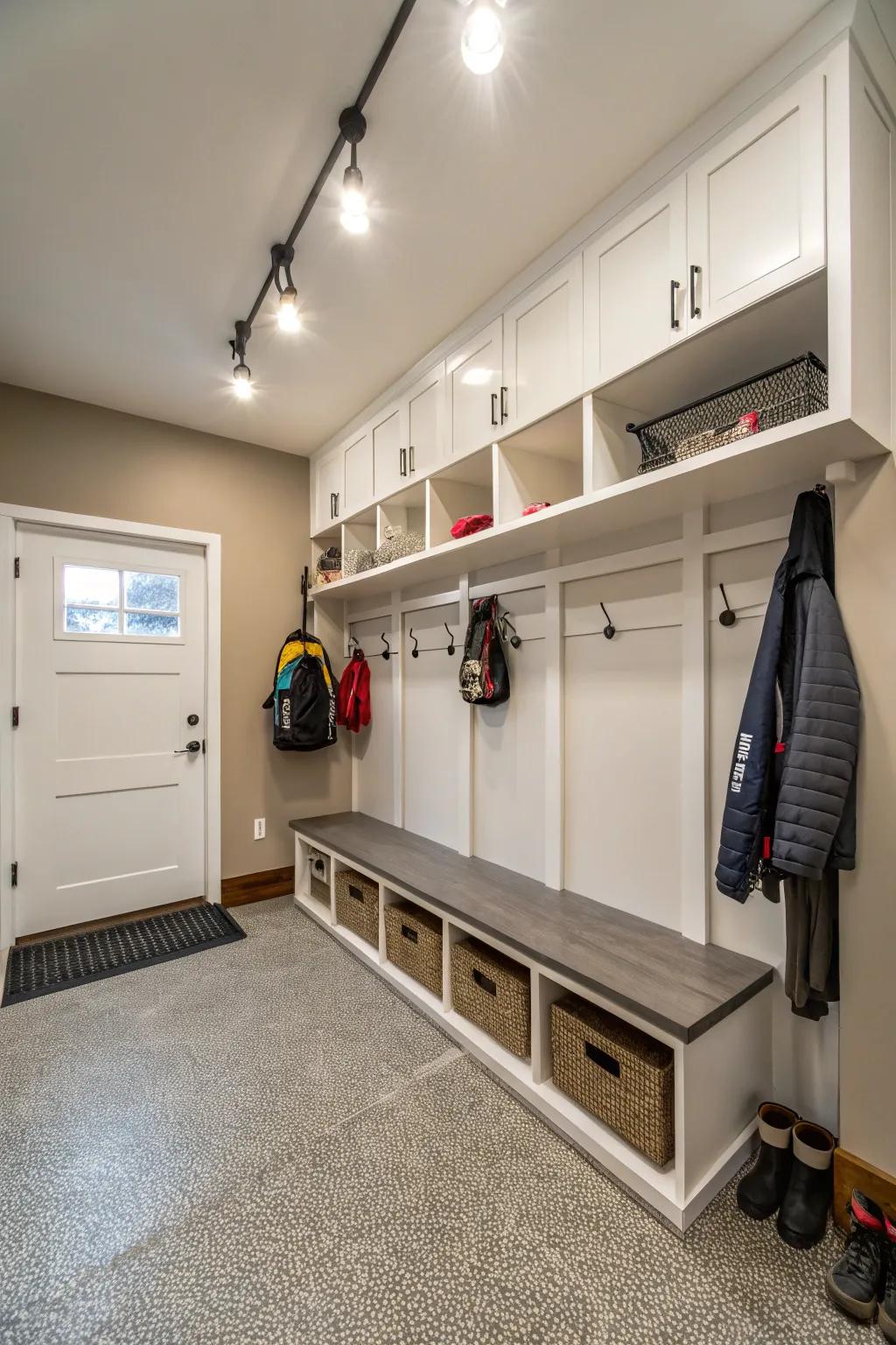 Bright lighting illuminates and enhances the ambiance of a garage mudroom.